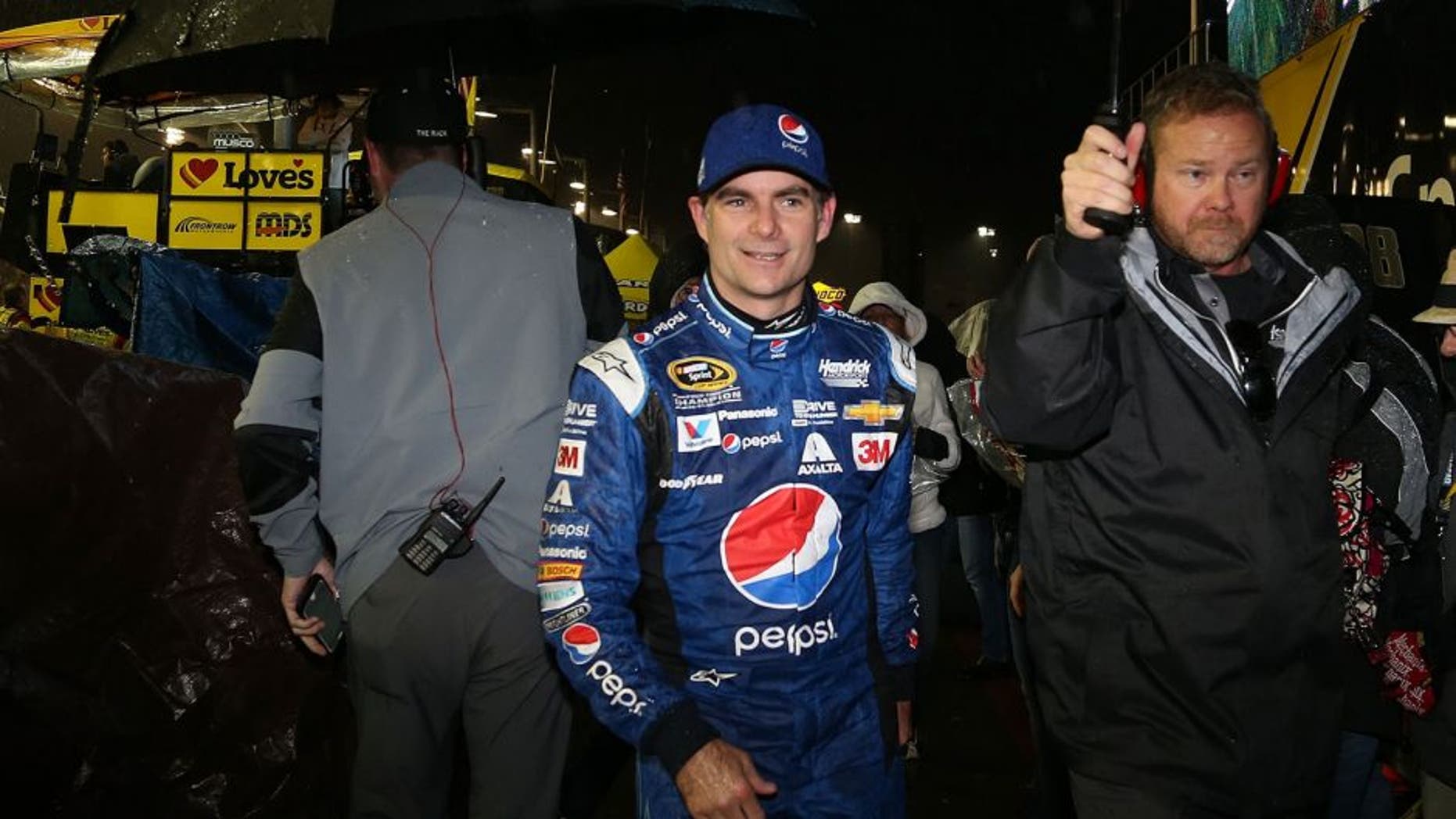 AVONDALE, AZ - NOVEMBER 15: Jeff Gordon, driver of the #24 Pepsi Chevrolet, walks off pit road in the rain during the NASCAR Sprint Cup Series Quicken Loans Race for Heroes 500 at Phoenix International Raceway on November 15, 2015 in Avondale, Arizona. (Photo by Matt Sullivan/NASCAR via Getty Images)