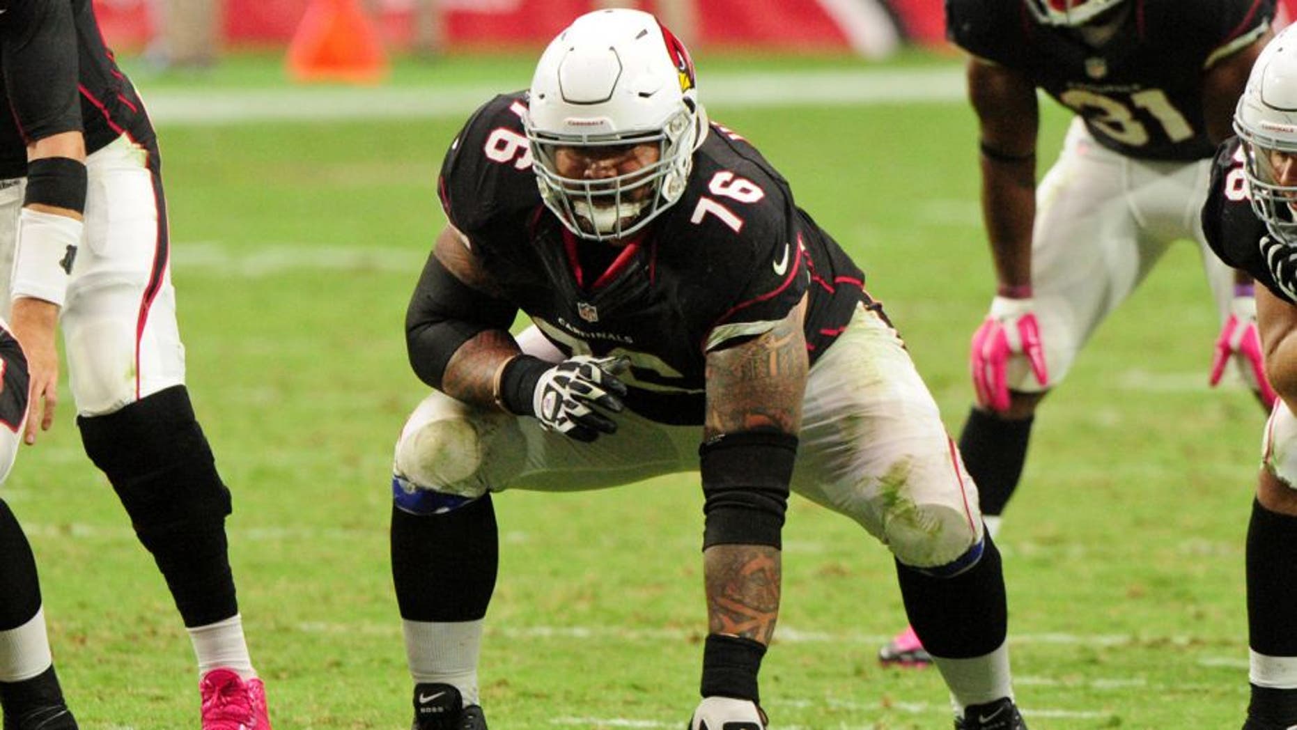 Oct 4, 2015; Glendale, AZ, USA; Arizona Cardinals guard Mike Iupati (76) looks on prior to the snap during the second half against the St. Louis Rams at University of Phoenix Stadium. Mandatory Credit: Matt Kartozian-USA TODAY Sports