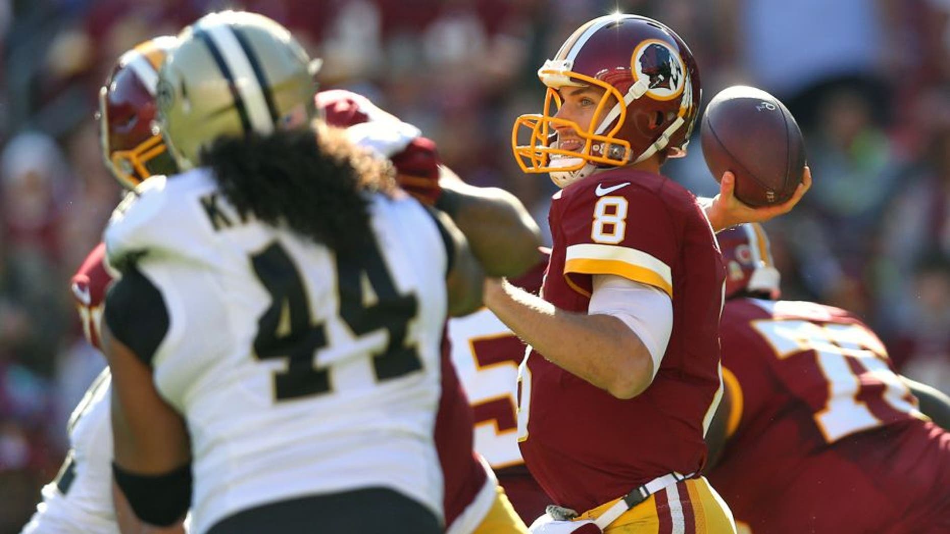 LANDOVER, MD - NOVEMBER 15: Quarterback Kirk Cousins #8 of the Washington Redskins makes a pass against the New Orleans Saints during the first half at FedExField on November 15, 2015 in Landover, Maryland. (Photo by Patrick Smith/Getty Images)