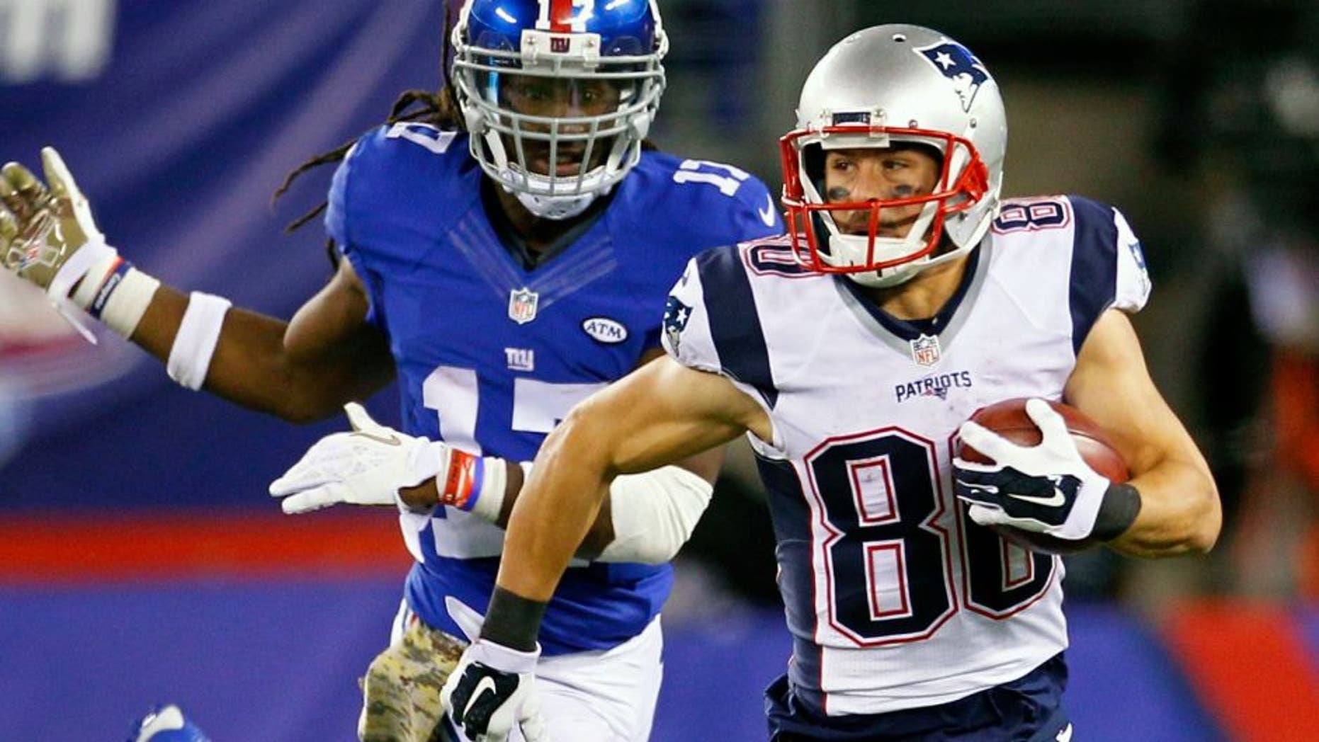 New England Patriots' Danny Amendola (80) runs away from New York Giants' Dwayne Harris (17) during the second half of an NFL football game Sunday, Nov. 15, 2015, in East Rutherford, N.J. (AP Photo/Gary Hershorn)
