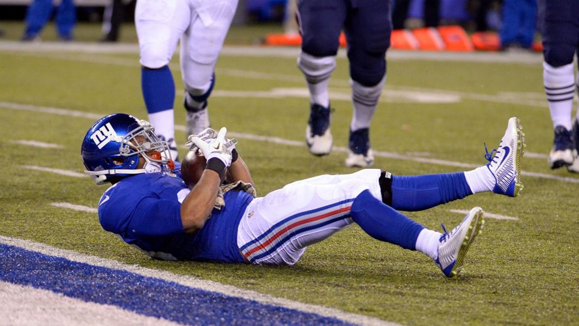 Nov 15, 2015; East Rutherford, NJ, USA; New York Giants cornerback Trumaine McBride (38) intercepts a pass against the New England Patriots during the game at MetLife Stadium. Mandatory Credit: Robert Deutsch-USA TODAY Sports