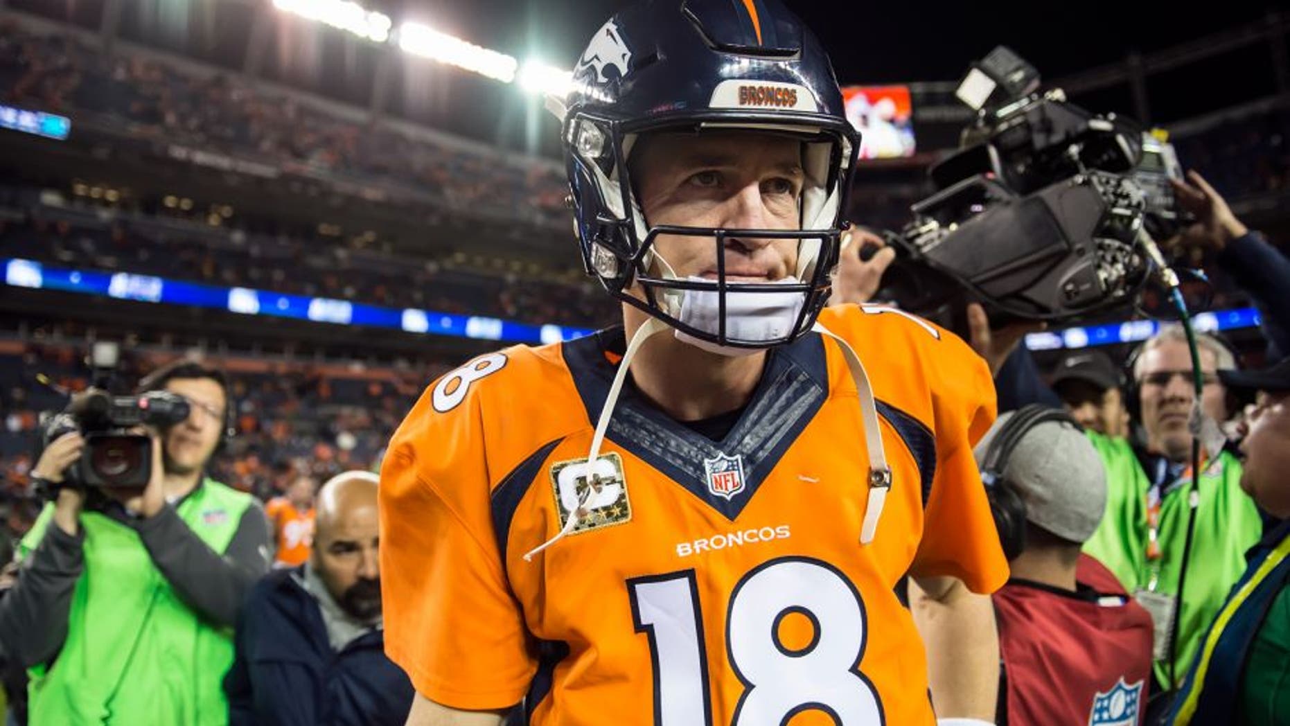 Denver Broncos quarterback Peyton Manning (18) walks off the field after throwing four interceptions and being replaced by Denver Broncos quarterback Brock Osweiler in the 29-13 loss to the Kansas City Chiefs on Sunday, Nov. 15, 2015, at Sports Authority Field at Mile High Stadium in Denver. (David Eulitt/Kansas City Star/TNS via Getty Images)
