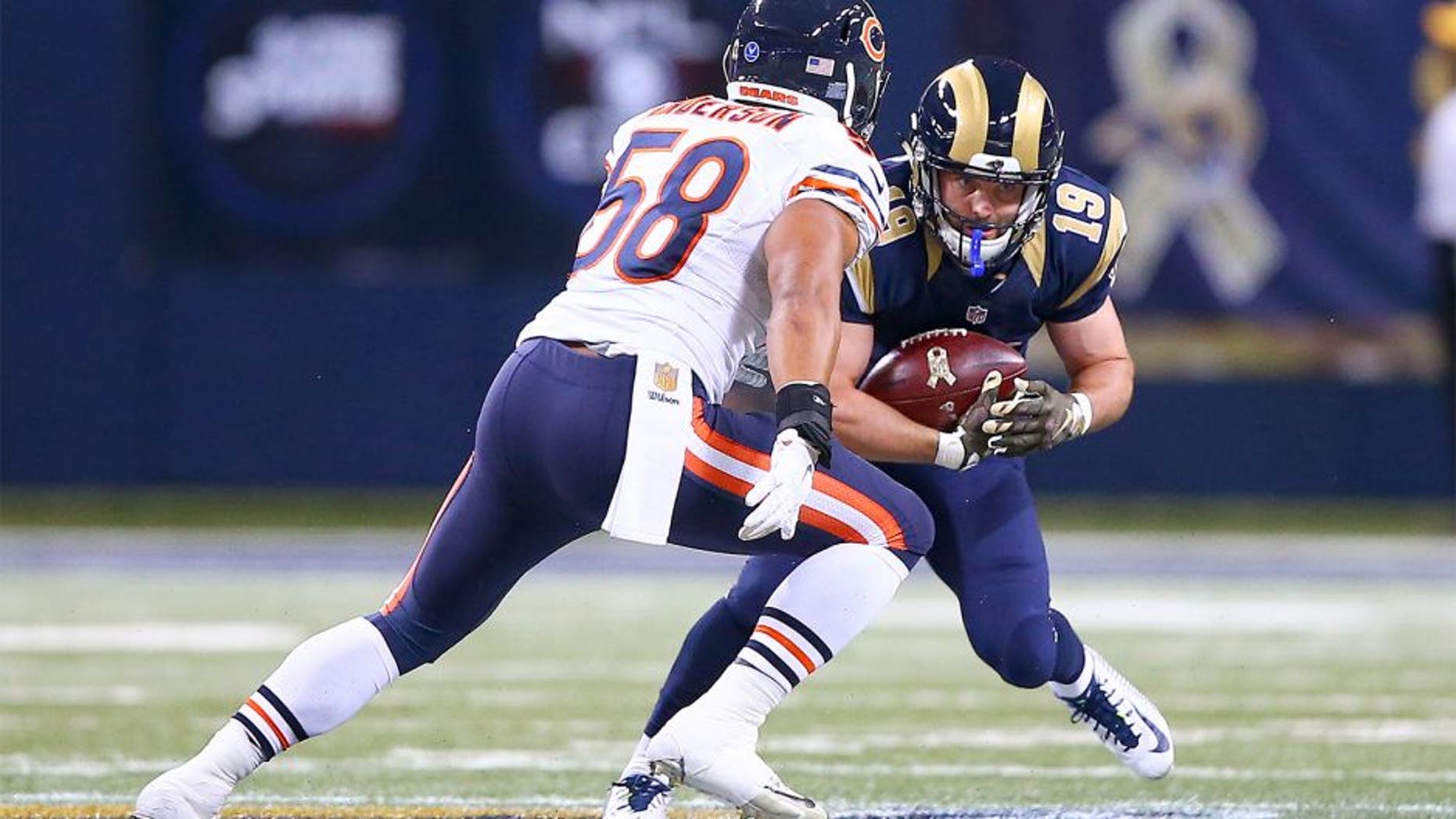 Nov 15, 2015; St. Louis, MO, USA; St. Louis Rams wide receiver Wes Welker (19) catches a pass for a first down as Chicago Bears outside linebacker Jonathan Anderson (58) closes in for the tackle during the second half at the Edward Jones Dome. The Bears won the game 37-13. Mandatory Credit: Billy Hurst-USA TODAY Sports