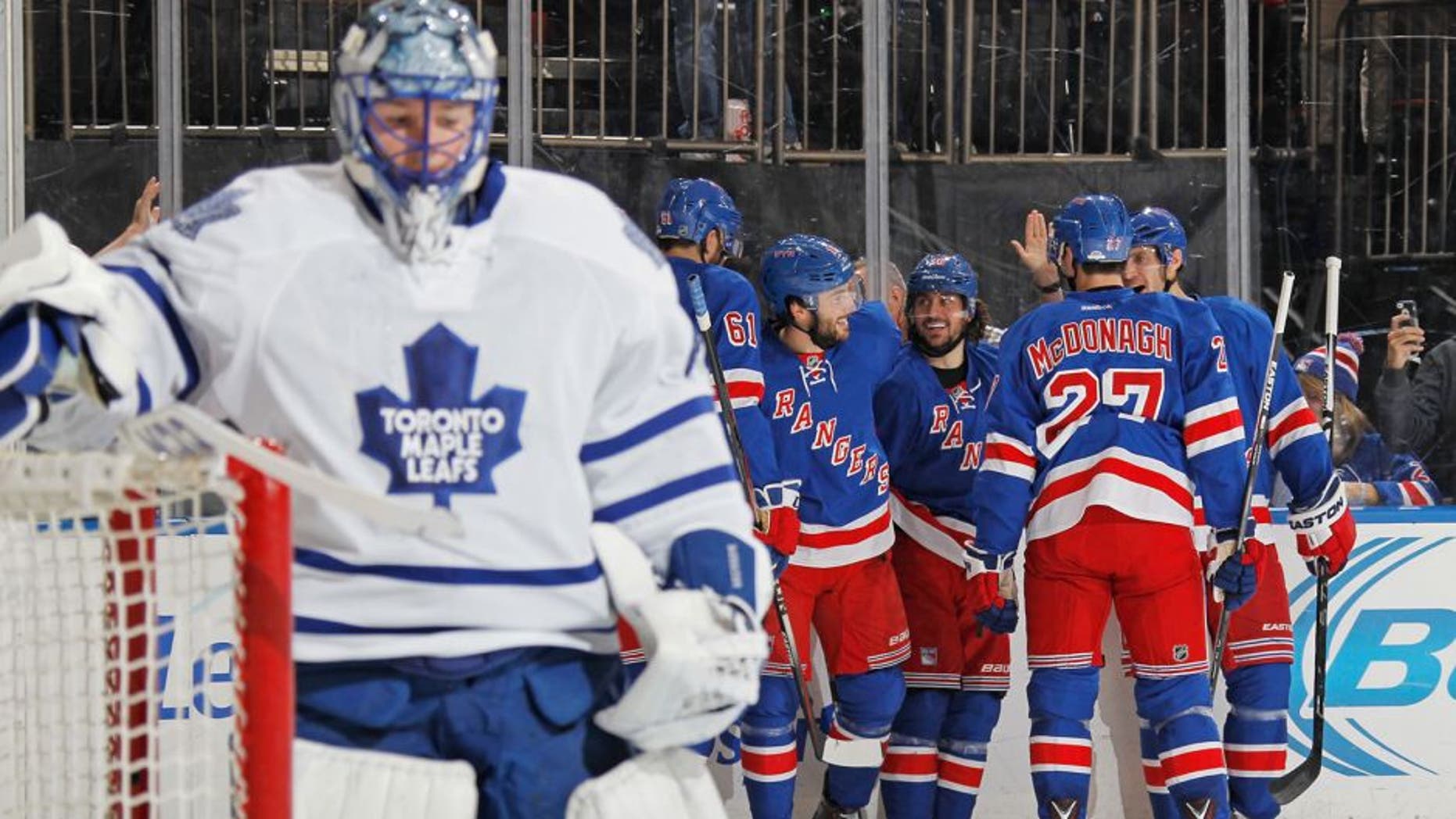 NEW YORK, NY - NOVEMBER 15: Mats Zuccarello #36, Derick Brassard #16, Rick Nash #61, Ryan McDonagh #27 and Dan Girardi #5 of the New York Rangers celebrate after scoring in the third period against Jonathan Bernier #45 of the Toronto Maple Leafs at Madison Square Garden on November 15, 2015 in New York City. (Photo by Jared Silber/NHLI via Getty Images)