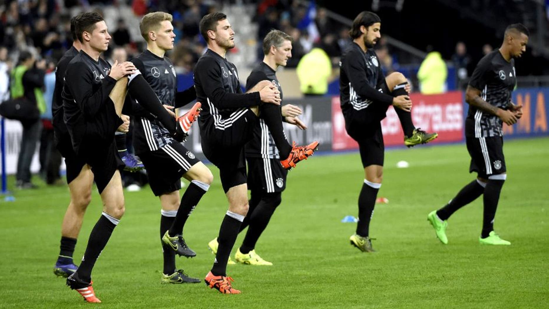 Germany's national football team warms up prior to a friendly international football match between France and Germany ahead of the Euro 2016, on November 13, 2015 at the Stade de France stadium in saint-Denis, north of Paris. AFP PHOTO / MIGUEL MEDINA (Photo credit should read MIGUEL MEDINA/AFP/Getty Images)