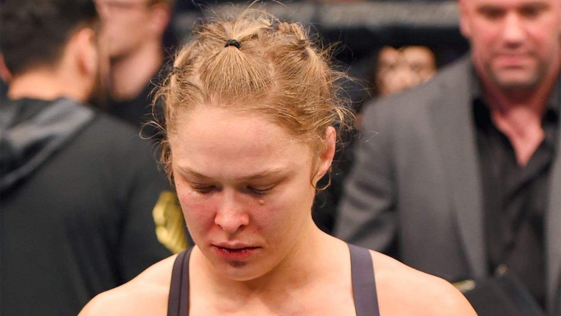MELBOURNE, AUSTRALIA - NOVEMBER 15: Ronda Rousey looks on after losing her championship title by KO (head kick and punches) to Holly Holm (not pictured) in two rounds of their UFC women's bantamweight championship bout during the UFC 193 event at Etihad Stadium on November 15, 2015 in Melbourne, Australia. (Photo by Josh Hedges/Zuffa LLC/Zuffa LLC via Getty Images)