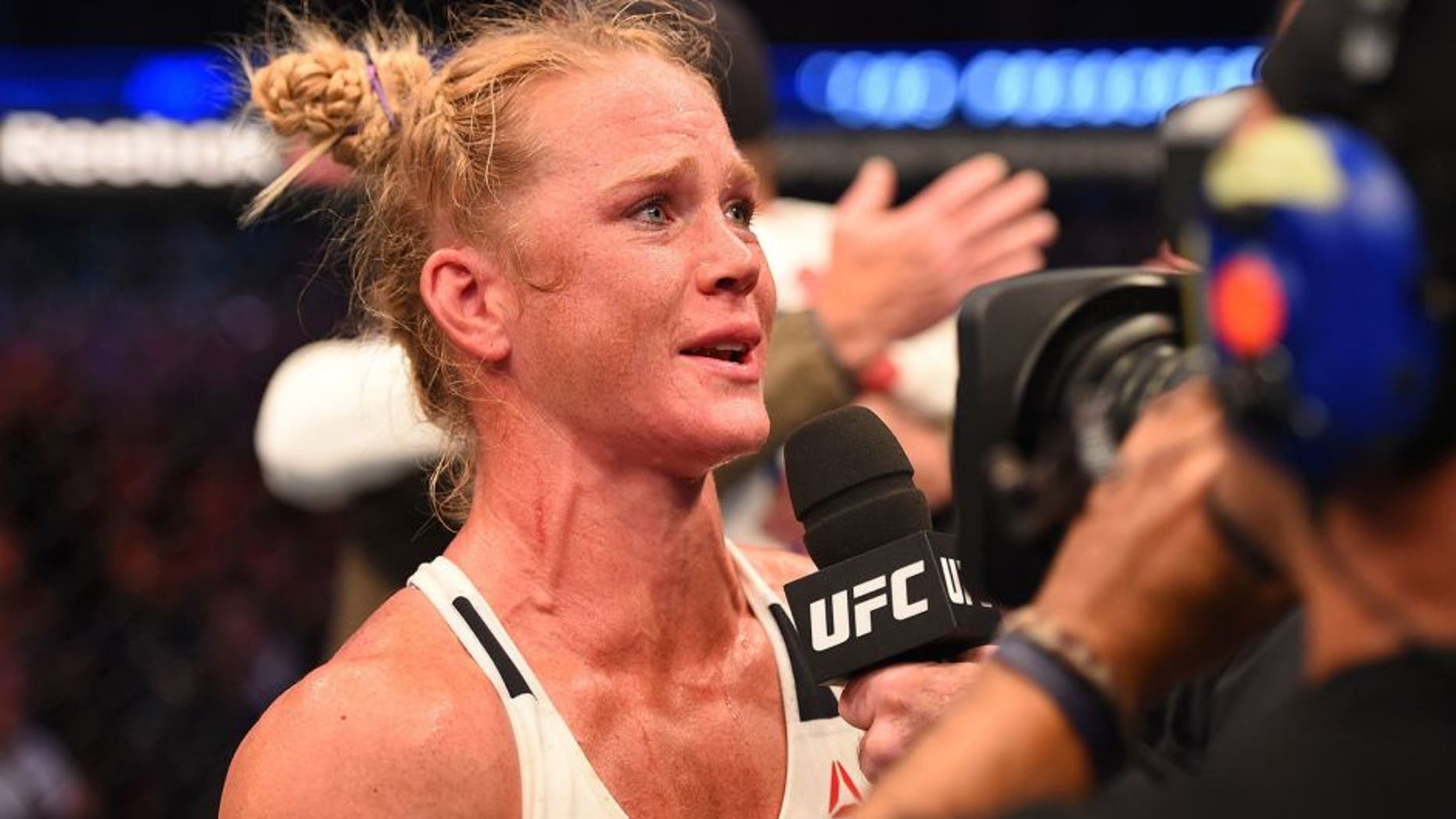 MELBOURNE, AUSTRALIA - NOVEMBER 15: Holly Holm is interviewed by Joe Rogan after her second round KO (head kick and punches) against Ronda Rousey (not pictured) to win their UFC women's bantamweight championship bout during the UFC 193 event at Etihad Stadium on November 15, 2015 in Melbourne, Australia. (Photo by Josh Hedges/Zuffa LLC/Zuffa LLC via Getty Images)