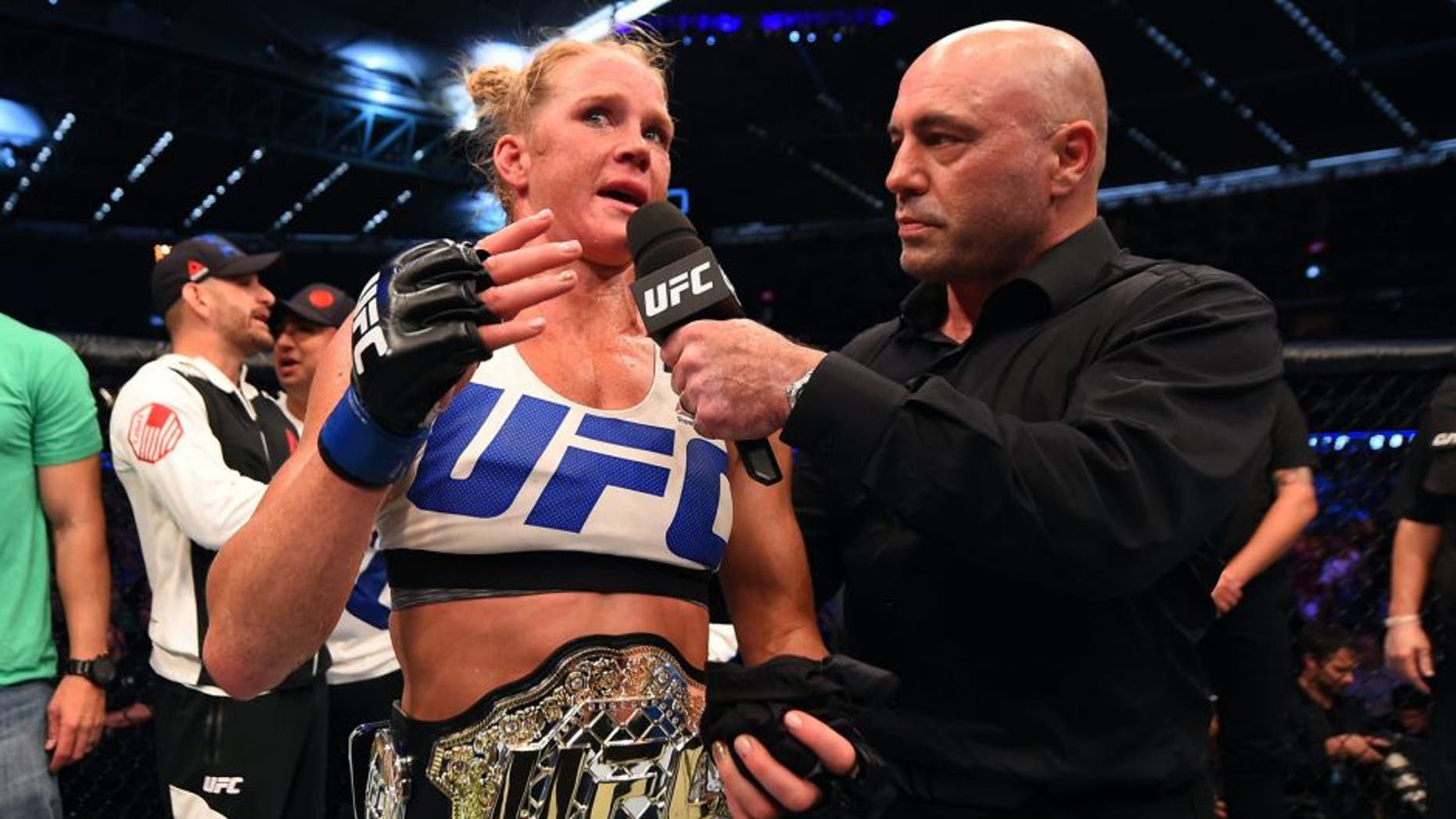 MELBOURNE, AUSTRALIA - NOVEMBER 15: Holly Holm is interviewed by Joe Rogan after her second round KO (head kick and punches) against Ronda Rousey (not pictured) to win their UFC women's bantamweight championship bout during the UFC 193 event at Etihad Stadium on November 15, 2015 in Melbourne, Australia. (Photo by Josh Hedges/Zuffa LLC/Zuffa LLC via Getty Images)