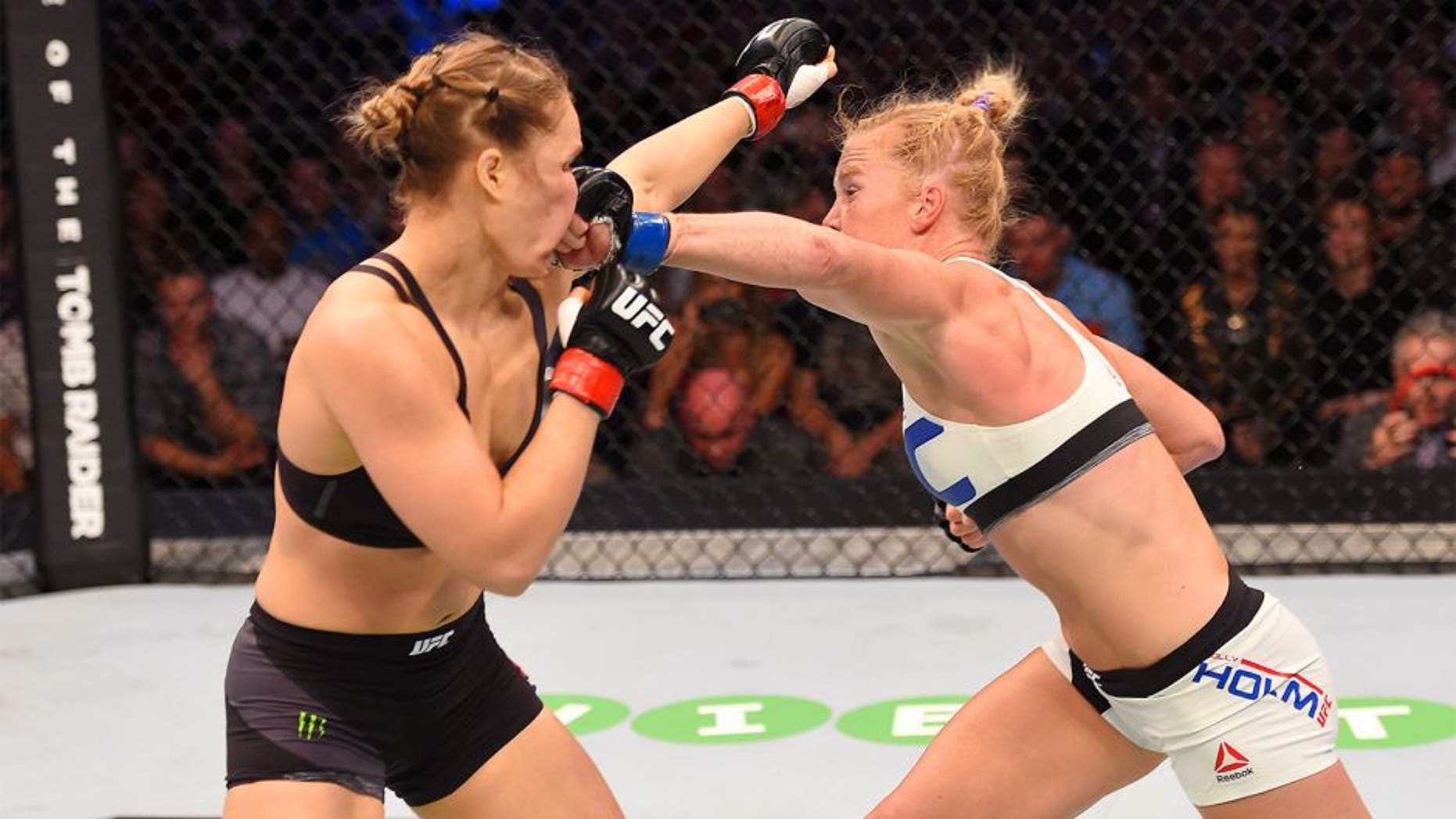 MELBOURNE, AUSTRALIA - NOVEMBER 15: Holly Holm (R) lands a punch against Ronda Rousey (L) in their UFC women's bantamweight championship bout during the UFC 193 event at Etihad Stadium on November 15, 2015 in Melbourne, Australia. (Photo by Josh Hedges/Zuffa LLC/Zuffa LLC via Getty Images)
