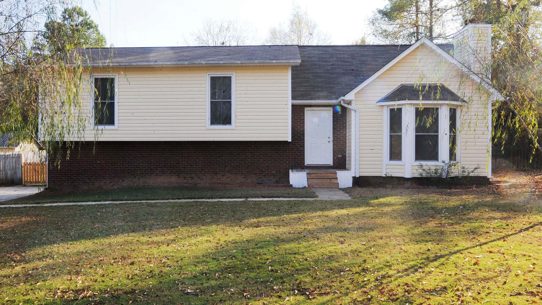 The suburban home where police say a 14-year-old boy was held for most of two years in the basement is shown on Tuesday, Nov. 15, 2016, in Helena, Ala.