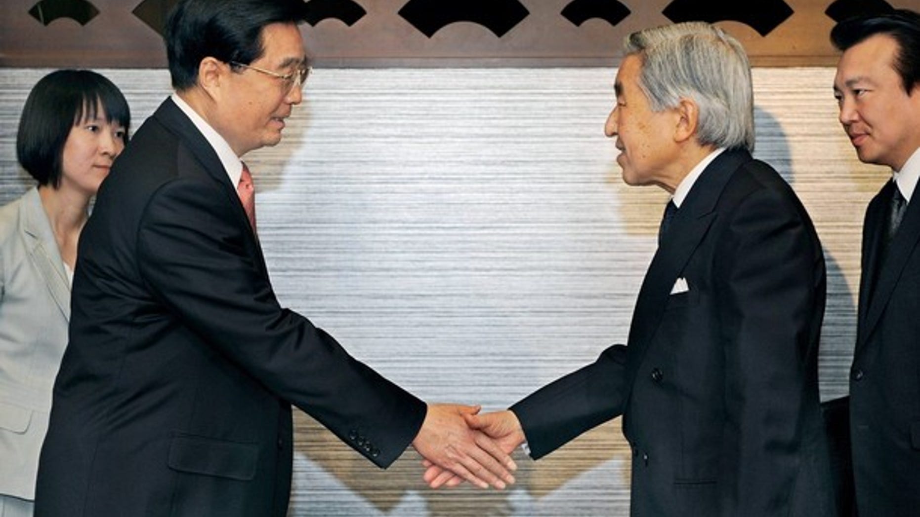 May 9, 2008: Chinese President Hu Jintao shakes hands with Japanese Emperor Akihito at a farewell call at a hotel in Tokyo (Reuters).