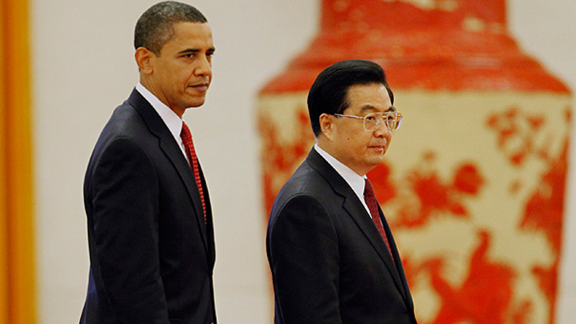 Nov. 17, 2010: President Obama walks with Chinese President Hu Jintao during a welcome ceremony at the Great Hall of the People in Beijing.