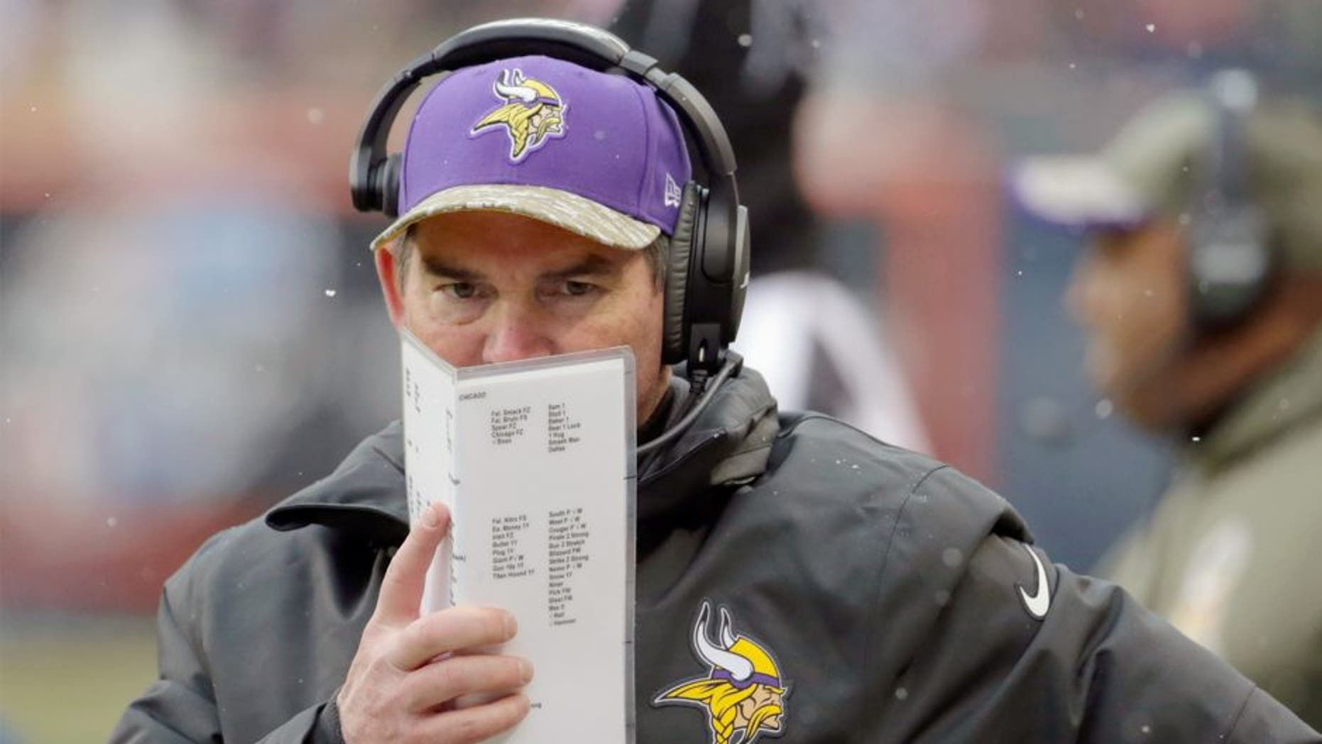 Minnesota Vikings head coach Mike Zimmer watches his team during the first half of an NFL football game against the Chicago Bears Sunday, Nov. 16, 2014 in Chicago. (AP Photo/Charles Rex Arbogast)