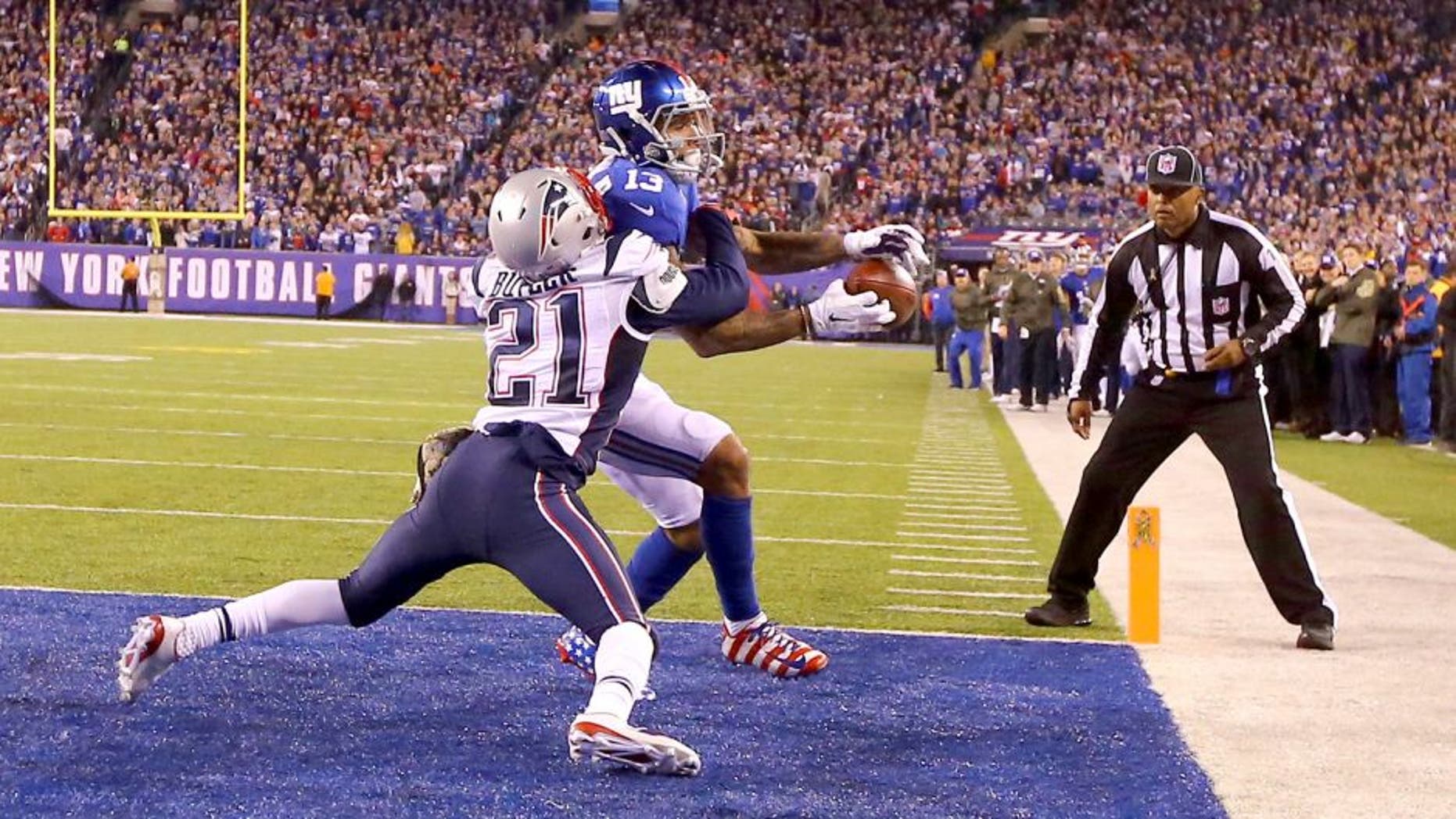 EAST RUTHERFORD, NJ - NOVEMBER 15: Odell Beckham #13 of the New York Giants cannot hold onto the ball which is broken up in the end zone by Malcolm Butler #21 of the New England Patriots in the fourth Quarter during their game at MetLife Stadium on November 15, 2015 in East Rutherford, New Jersey. (Photo by Al Bello/Getty Images)