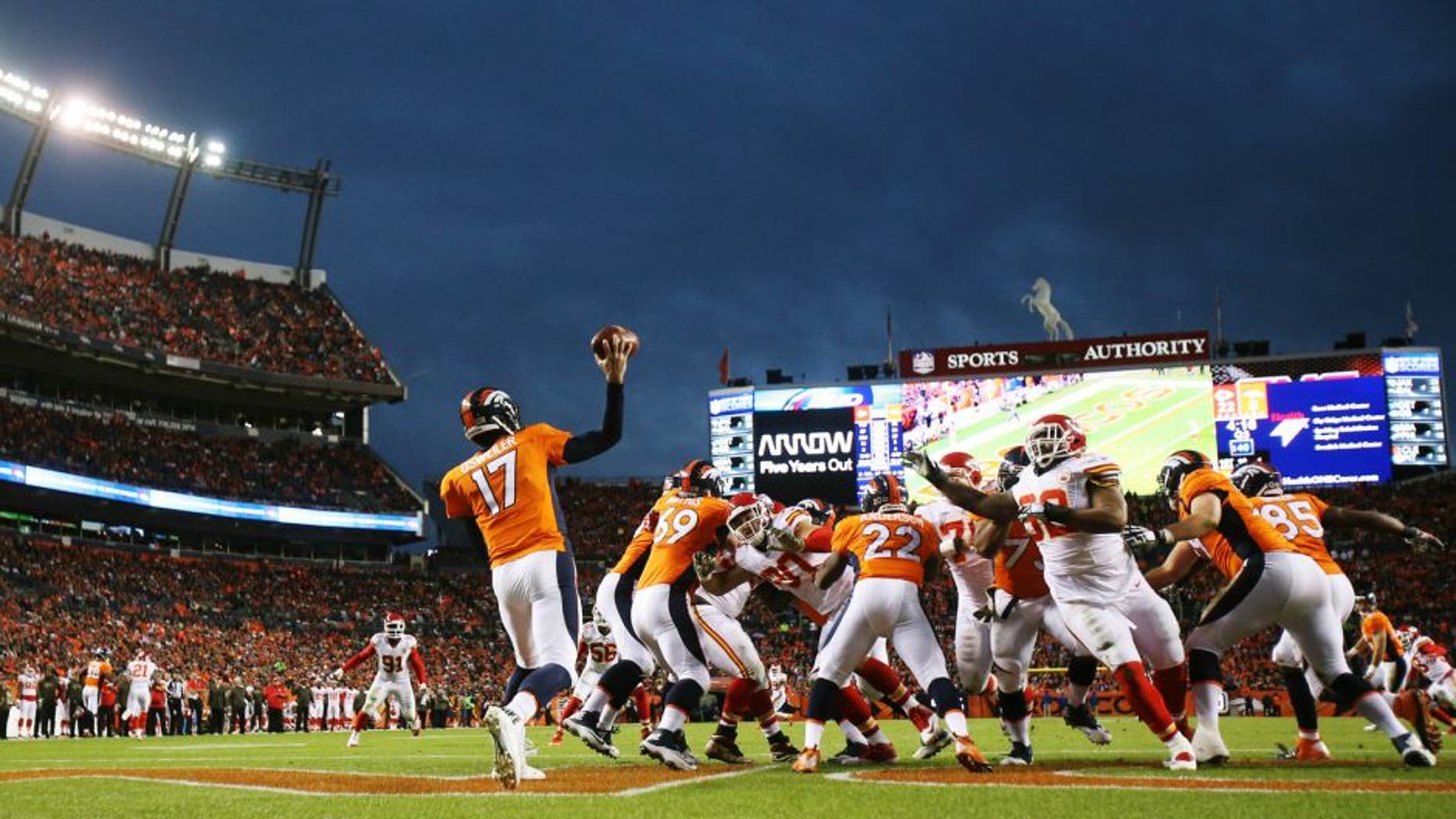 Nov 15, 2015; Denver, CO, USA; Denver Broncos quarterback Brock Osweiler (17) throws a pass during the second half against the Kansas City Chiefs at Sports Authority Field at Mile High. The Chiefs won 29-13. Mandatory Credit: Chris Humphreys-USA TODAY Sports