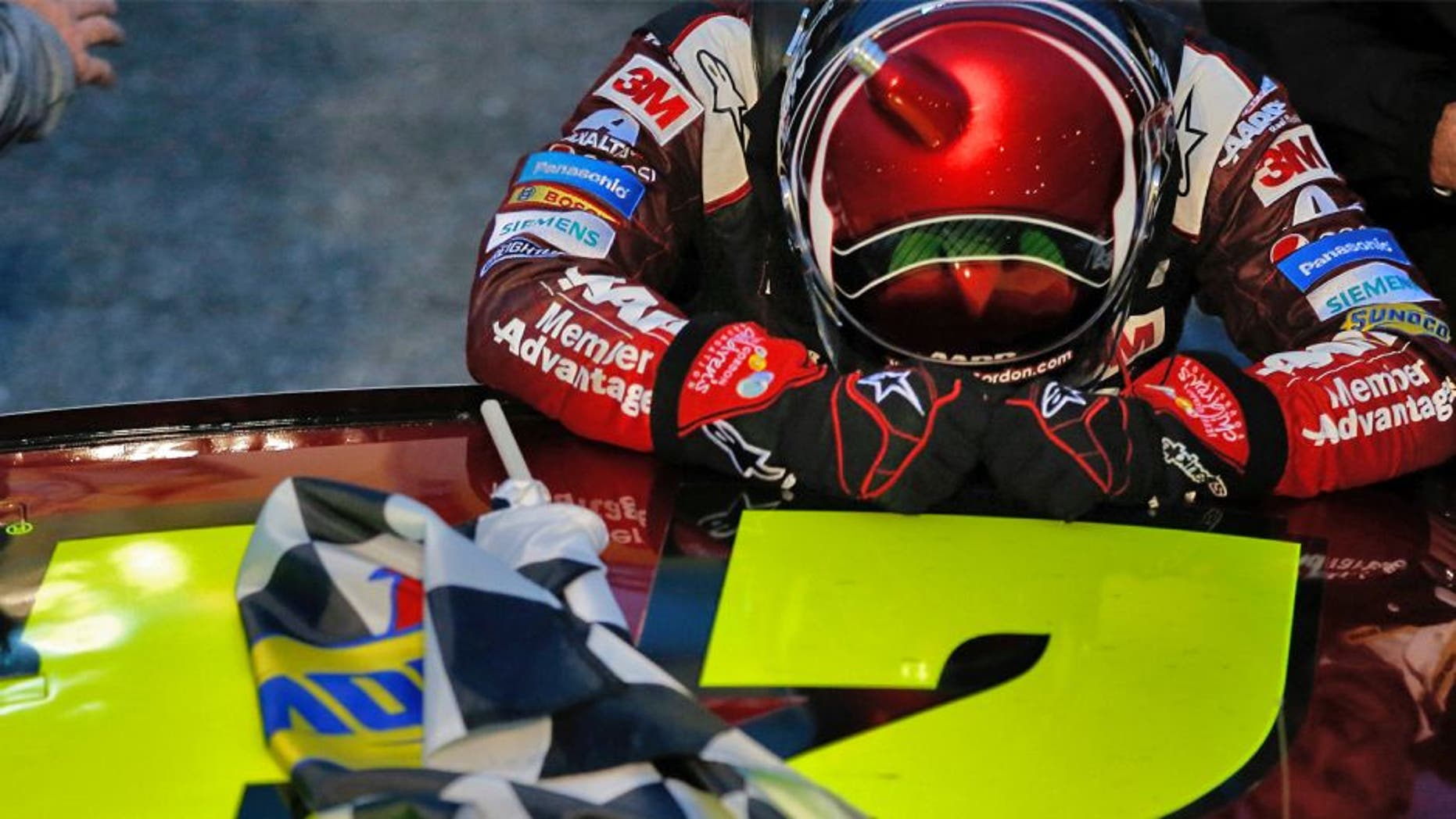 MARTINSVILLE, VA - NOVEMBER 01: Jeff Gordon, driver of the #24 AARP Member Advantages Chevrolet, pauses for a moment after winning the NASCAR Sprint Cup Series Goody's Headache Relief Shot 500 at Martinsville Speedway on November 1, 2015 in Martinsville, Virginia. (Photo by Todd Warshaw/NASCAR via Getty Images)