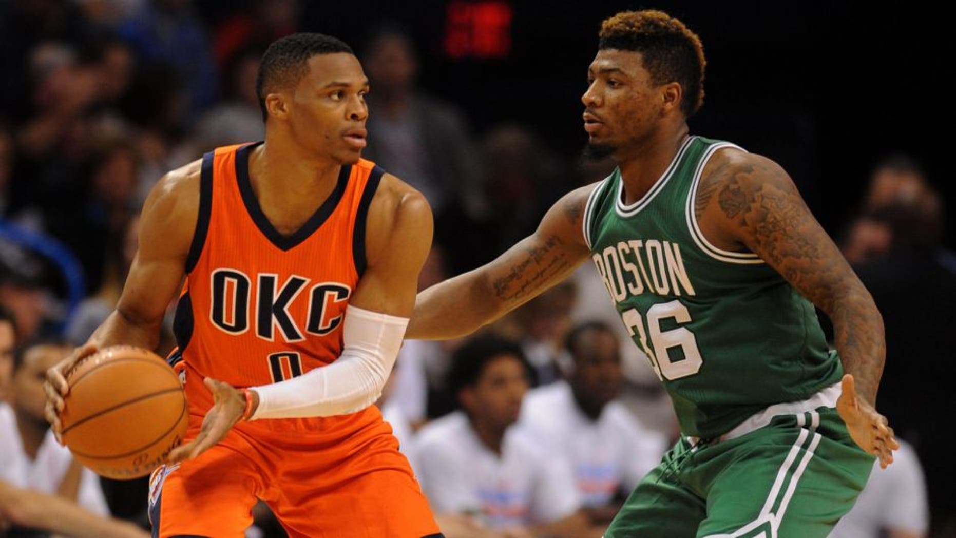 Nov 15, 2015; Oklahoma City, OK, USA; Oklahoma City Thunder guard Russell Westbrook (0) handles the ball while being guarded by Boston Celtics guard Marcus Smart (36) during the third quarter at Chesapeake Energy Arena. Mandatory Credit: Mark D. Smith-USA TODAY Sports