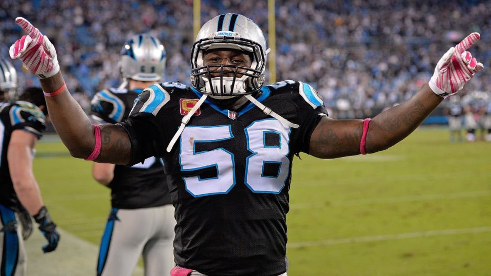 CHARLOTTE, NC - OCTOBER 25: Thomas Davis #58 of the Carolina Panthers leads the fans in singing "Sweet Caroline" after a win against the Philadelphia Eagles at Bank of America Stadium on October 25, 2015 in Charlotte, North Carolina. The Panthers won 27-16. (Photo by Grant Halverson/Getty Images)