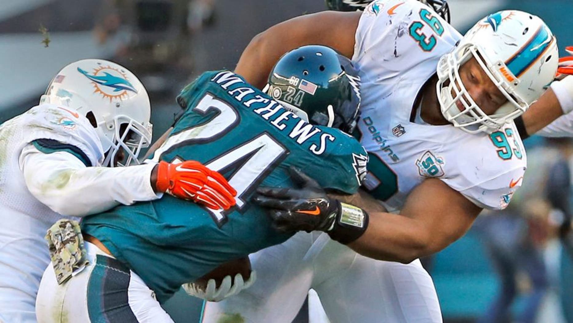 Miami Dolphins' Reshad Jones and Ndamukong Suh tackle Philadelphia Eagles' Ryan Mathews during the third quarter on Sunday, Nov. 15, 2015, at Lincoln Financial Field in Philadelphia. (Charles Trainor Jr./Miami Herald/TNS via Getty Images)