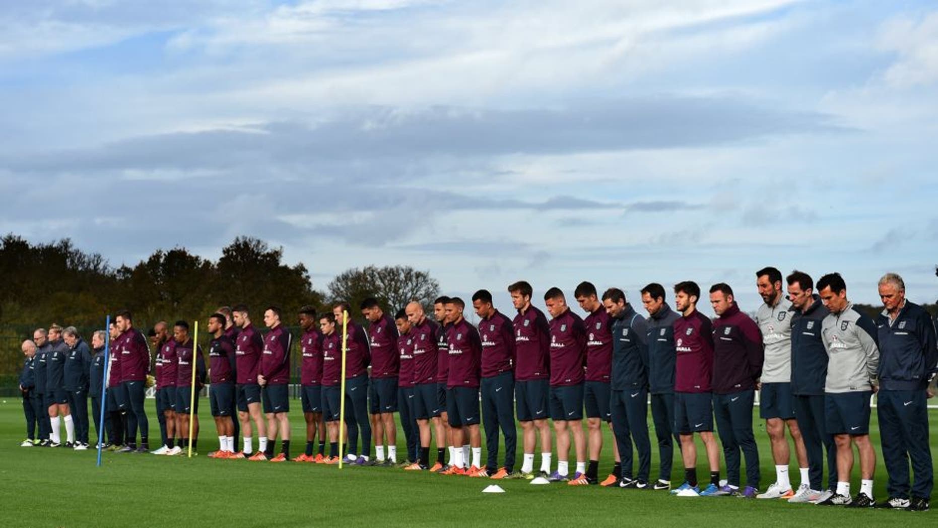 ENFIELD, ENGLAND - NOVEMBER 16: The England squad and coaching staff observe a silence in remembrance to the victims of last weeks Paris terror attacks during the England Training Session at the Tottenham Hotspur training ground on November 16, 2015 in Enfield, England. (Photo by Michael Regan - The FA/The FA via Getty Images)