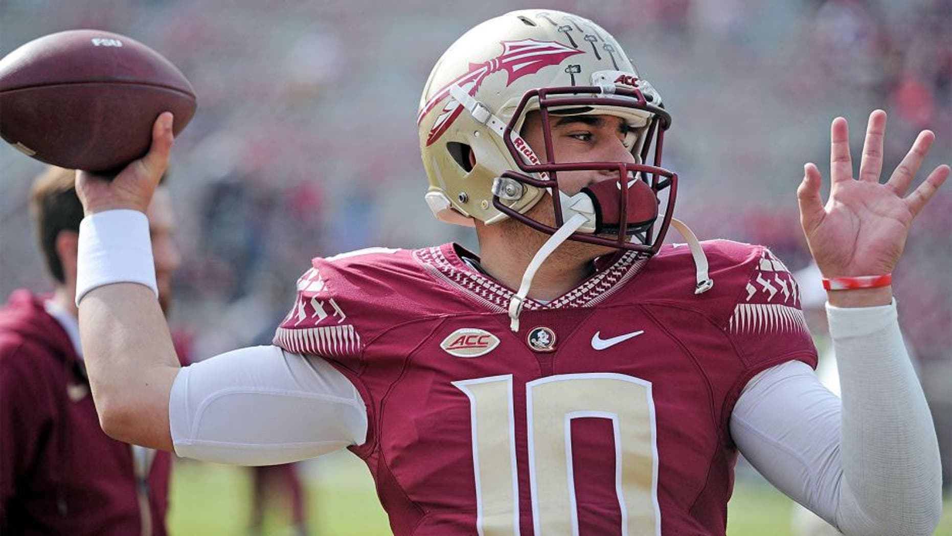 Nov 14, 2015; Tallahassee, FL, USA; Florida State University quarterback Sean Maguire (10) warms up before the game against the North Carolina State Wolfpack at Doak Campbell Stadium. Mandatory Credit: Melina Vastola-USA TODAY Sports