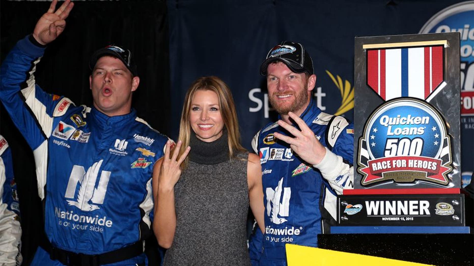 AVONDALE, AZ - NOVEMBER 15: (L-R) Amy Reimann celebrates with Dale Earnhardt Jr., driver of the #88 Nationwide Chevrolet, in victory lane after Earnhardt won the rain-shortened NASCAR Sprint Cup Series Quicken Loans Race for Heroes 500 at Phoenix International Raceway on November 15, 2015 in Avondale, Arizona. (Photo by Matt Sullivan/NASCAR via Getty Images)