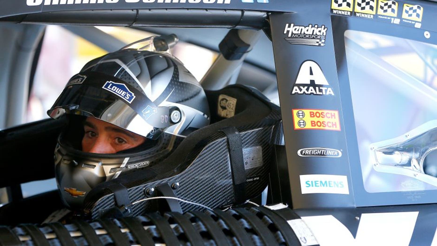AVONDALE, AZ - NOVEMBER 11: Jimmie Johnson, driver of the #48 Kobalt Chevrolet, sits in his car during practice for the NASCAR Sprint Cup Series Can-Am 500 at Phoenix International Raceway on November 11, 2016 in Avondale, Arizona. (Photo by Jonathan Ferrey/Getty Images)
