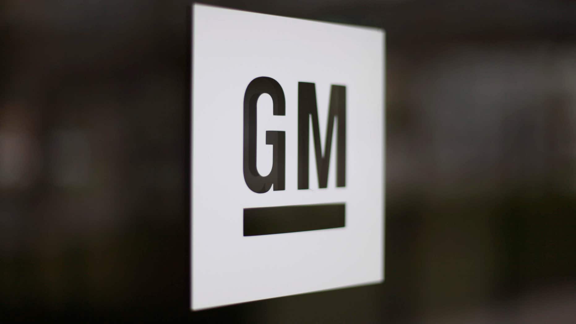 FILE - This Friday, May 16, 2014, file photo, shows the General Motors logo at the company's world headquarters in Detroit.