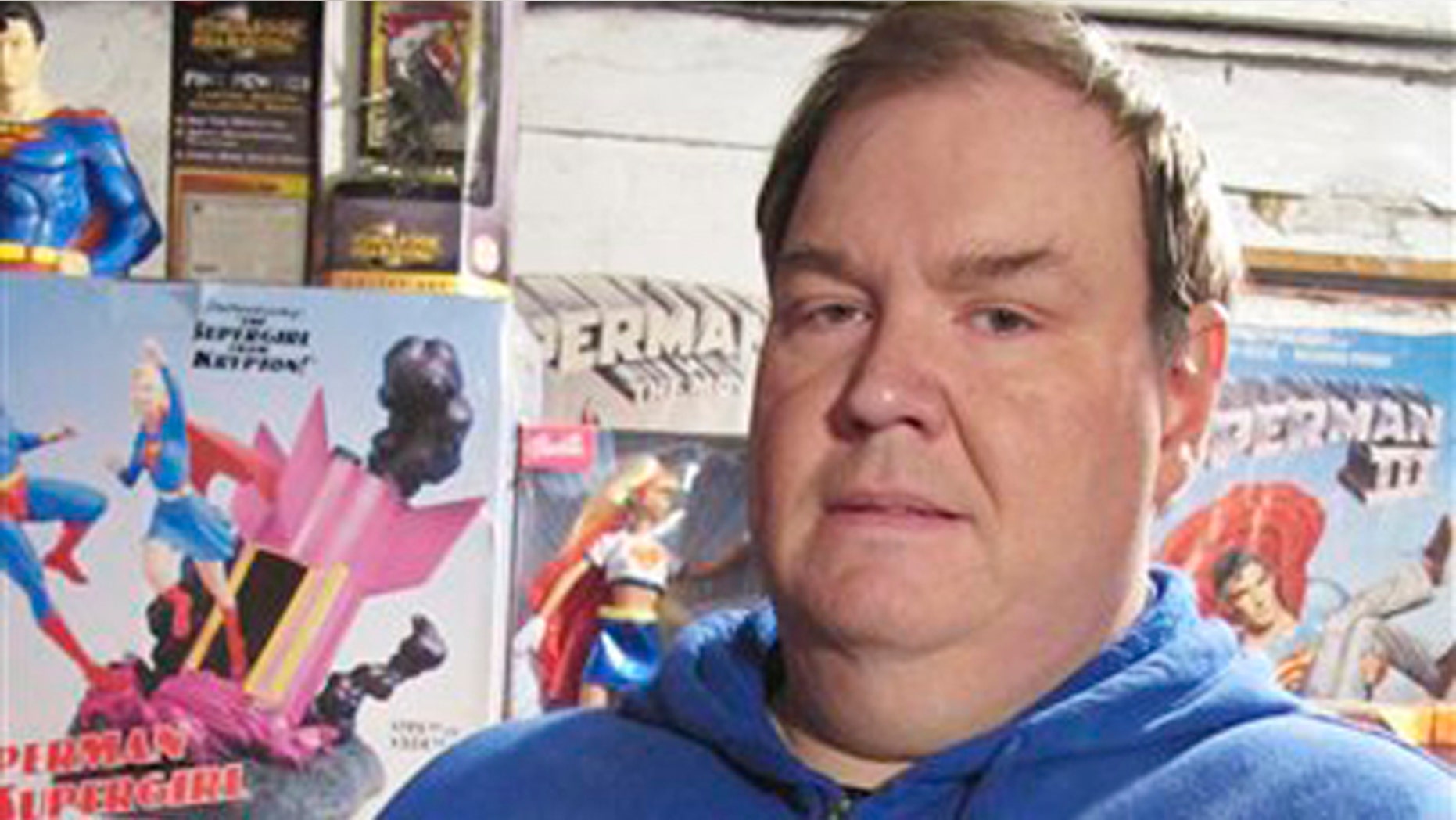 November 17, 2011: Mike Meyer, 48, shows off one of his favorIte items of his decades-old Superman collection, a Man of Steel figure from the mid-1960s, in his home in Granite City, Ill.