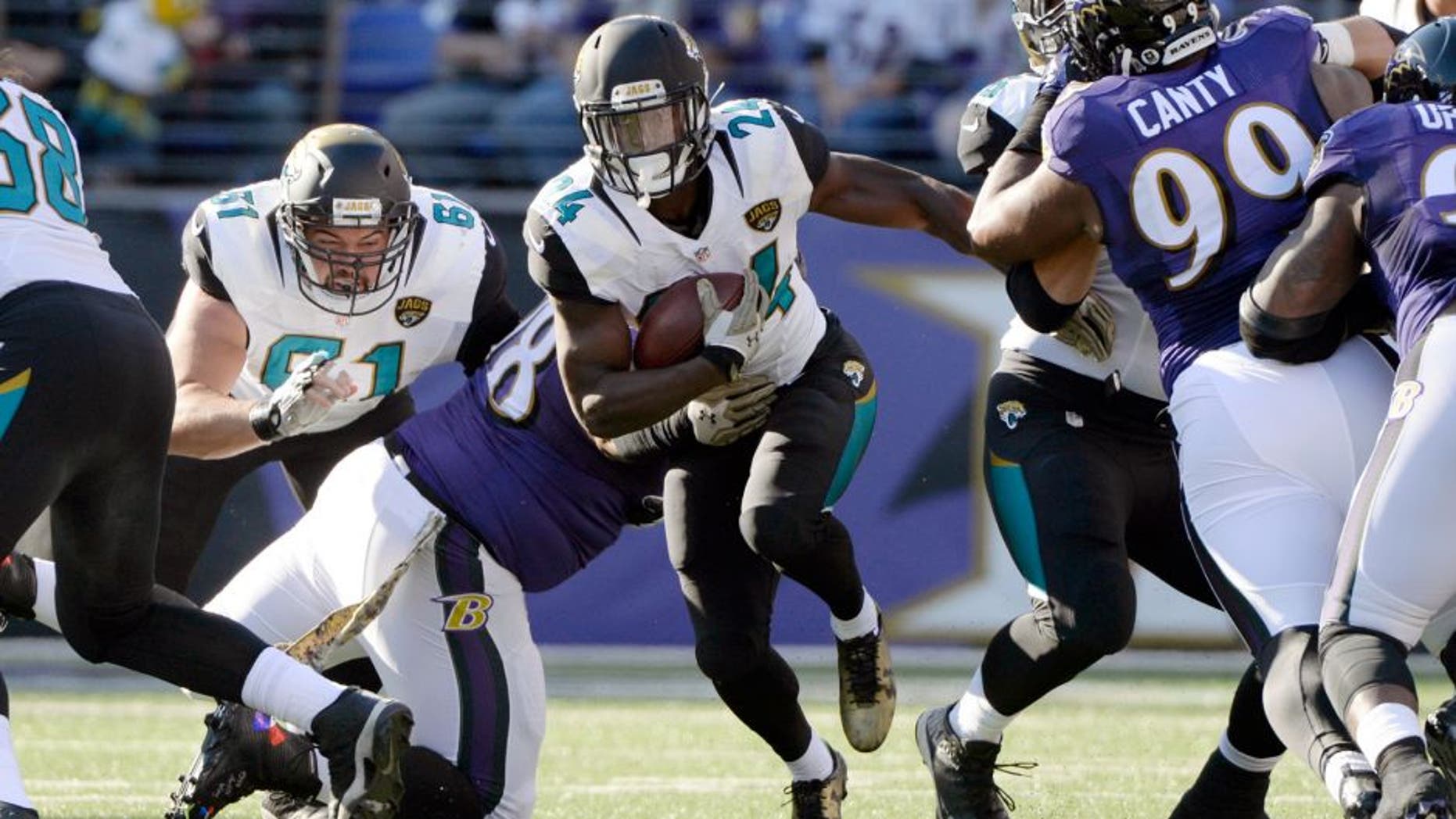 Nov 15, 2015; Baltimore, MD, USA; Jacksonville Jaguars running back T.J. Yeldon (24) runs during the first quarter against the Baltimore Ravens at M&T Bank Stadium. Mandatory Credit: Tommy Gilligan-USA TODAY Sports