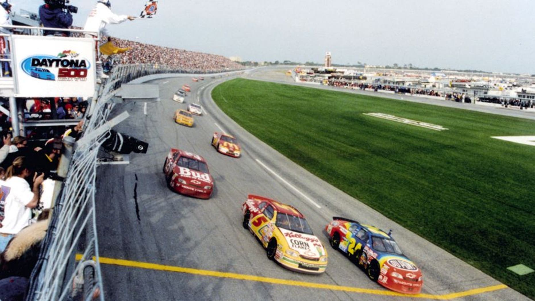 DAYTONA BEACH, FL - FEBRUARY 16, 1997: Jeff Gordon (#24) leads teammates Terry Labonte (#5) and Ricky Craven (#25) across the 1997 Daytona 500 finish line. The race finished under caution after a late race crash brought out the yellow. (Photo by ISC Archives via Getty Images)