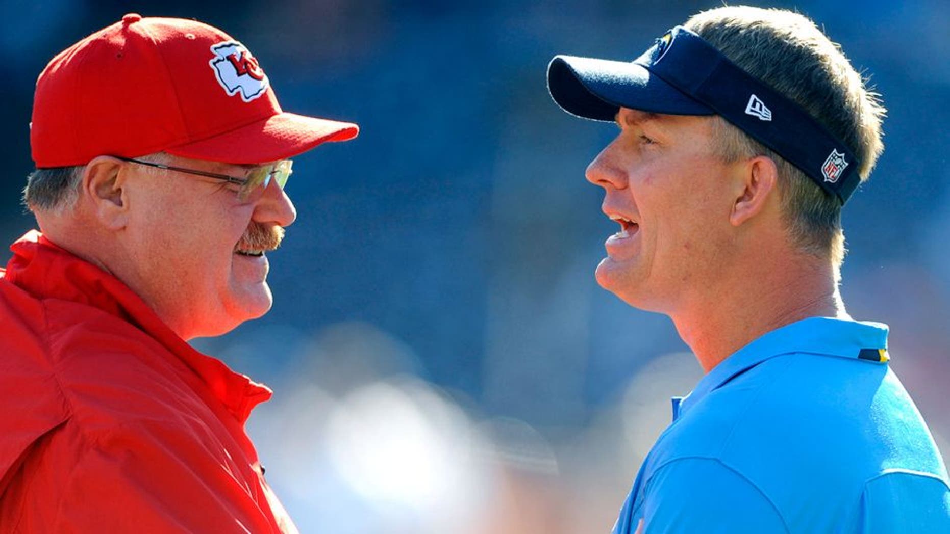 Dec 29, 2013; San Diego, CA, USA; San Diego Chargers head coach Mike McCoy (l) talks with Kansas City Chiefs head coach Andy Reid (r) prior to the game at Qualcomm Stadium. Mandatory Credit: Christopher Hanewinckel-USA TODAY Sports