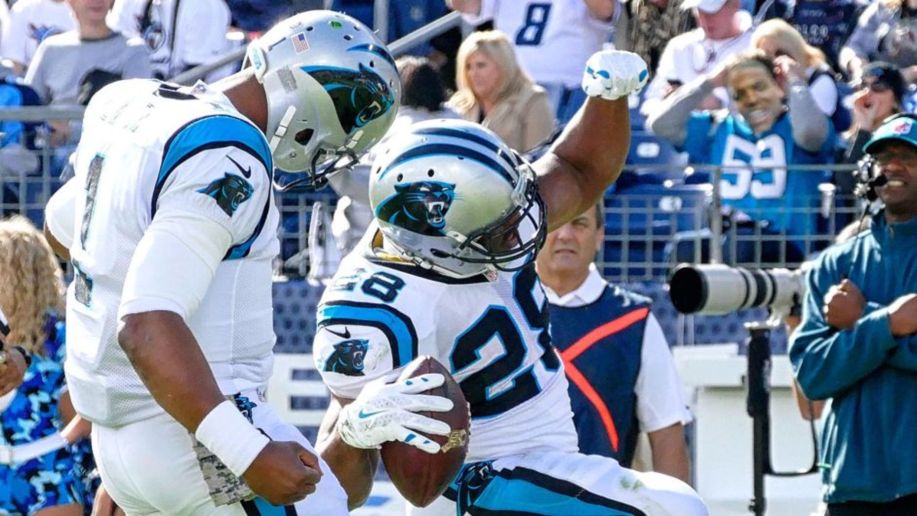NASHVILLE, TN - NOVEMBER 15: Jonathan Stewart #28 of the Carolina Panthers celebrates with quarterback Cam Newton #1 after scoring a against the Tennessee Titans during the first half at Nissan Stadium on November 15, 2015 in Nashville, Tennessee. (Photo by Frederick Breedon/Getty Images)