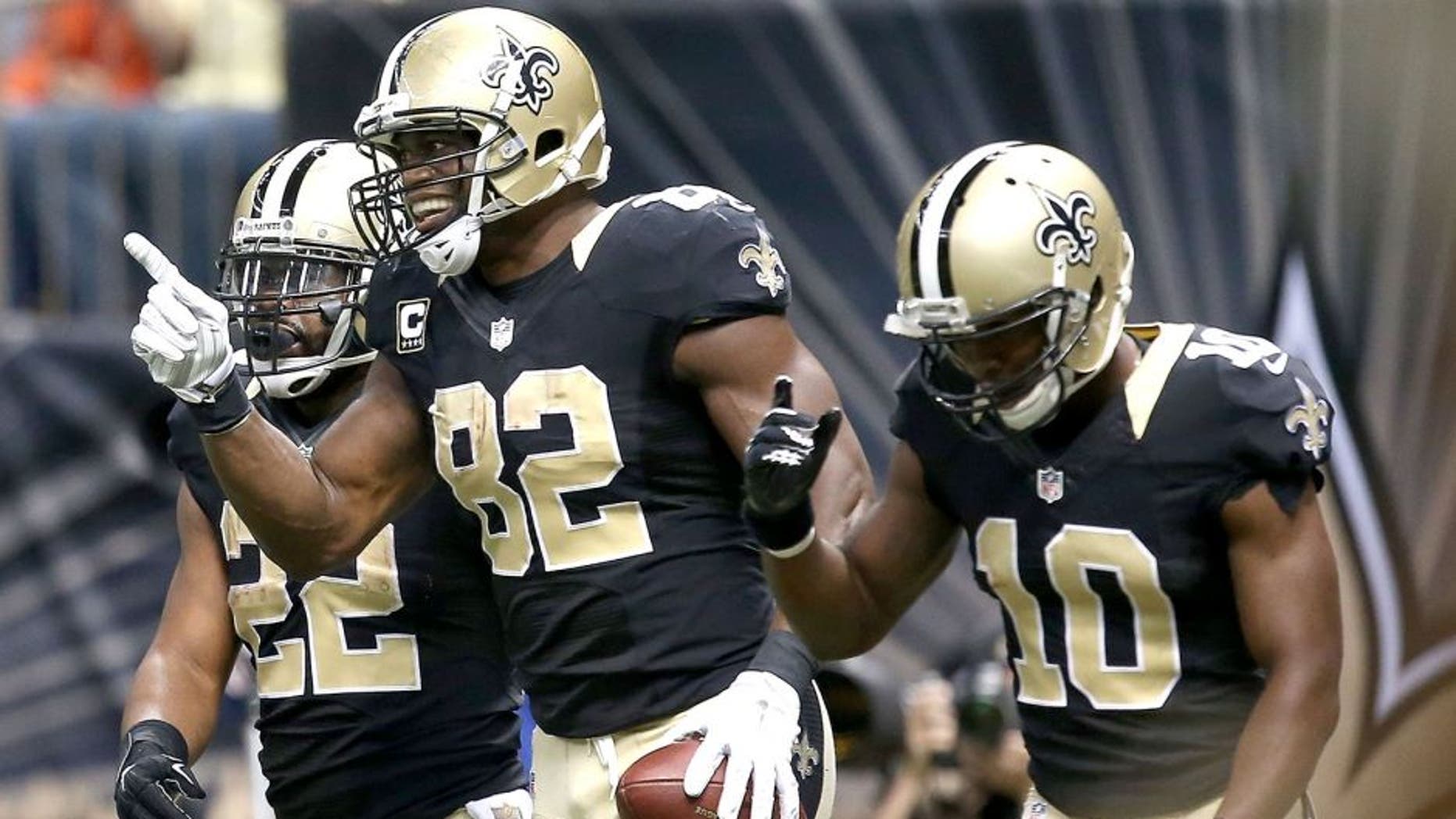 NEW ORLEANS, LA - NOVEMBER 01: Benjamin Watson #82 of the New Orleans Saints celebrates with Brandin Cooks #10 and Mark Ingram #22 after scoring a touchdown against the New York Giants at the Mercedes-Benz Superdome on November 1, 2015 in New Orleans, Louisiana. (Photo by Sean Gardner/Getty Images)