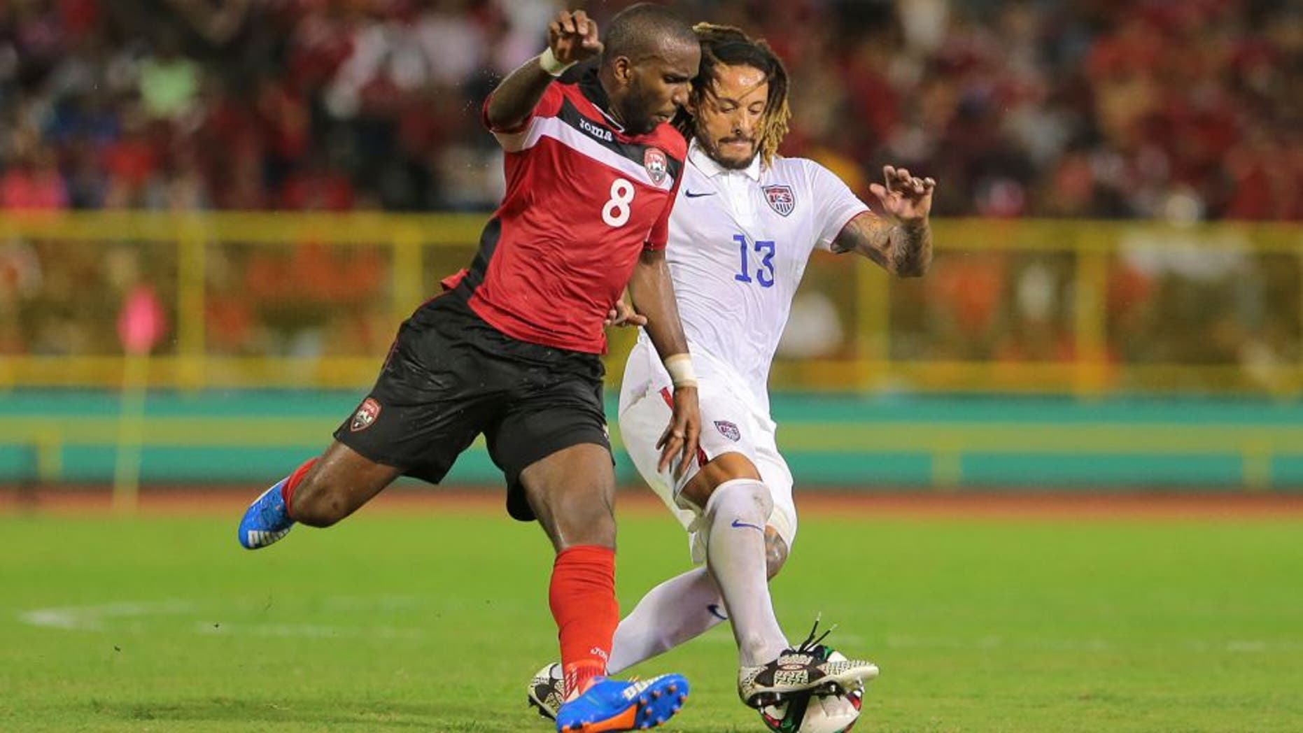 PORT OF SPAIN, TRINIDAD & TOBAGO - NOVEMBER 17: T&T's Khaleem Hyland battles to win the ball from USA's Jermaine Jones #13 during a World Cup Qualifier between Trinidad and Tobago and USA as part of the FIFA World Cup Qualifiers for Russia 2018 at Hasely Crawford Stadium on November 17, 2015 in Port of Spain, Trinidad & Tobago. (Photo by Ashley Allen Getty Images)
