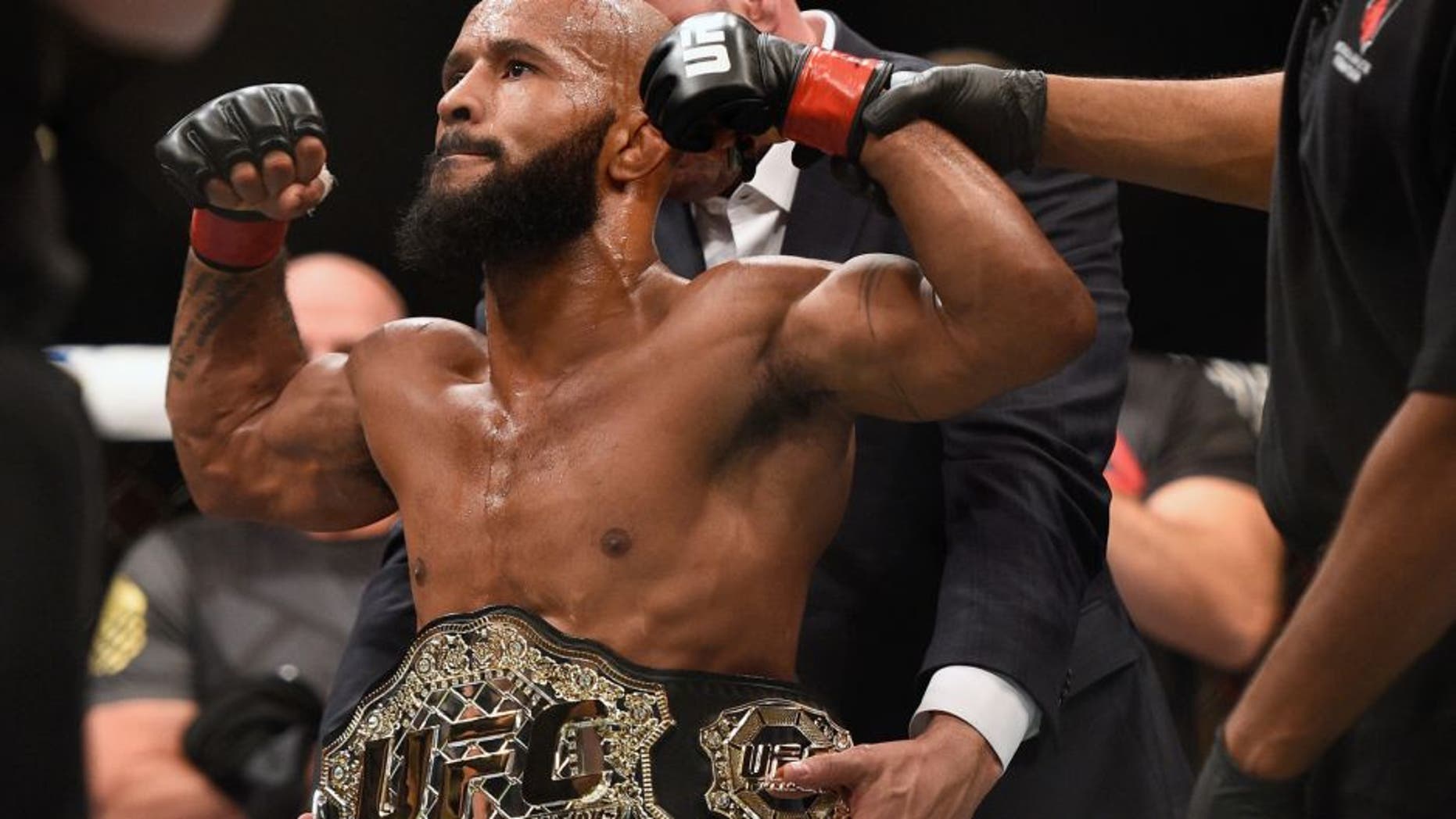 LAS VEGAS, NV - SEPTEMBER 05: Demetrious Johnson reacts after his victory over John Dodson in their flyweight championship bout during the UFC 191 event inside MGM Grand Garden Arena on September 5, 2015 in Las Vegas, Nevada. (Photo by Jeff Bottari/Zuffa LLC/Zuffa LLC via Getty Images)