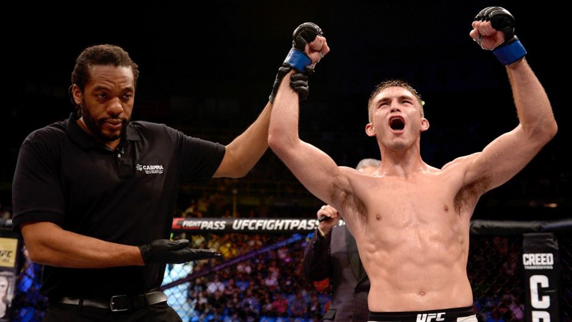 SAO PAULO, BRAZIL - NOVEMBER 07: Johnny Case of the United States celebrates victory over Yan Cabral of Brazil in their lightweight bout during the UFC Fight Night Belfort v Henderson at Ibirapuera Gymnasium on November 7, 2015 in Sao Paulo, Brazil. (Photo by Buda Mendes/Zuffa LLC/Zuffa LLC via Getty Images)