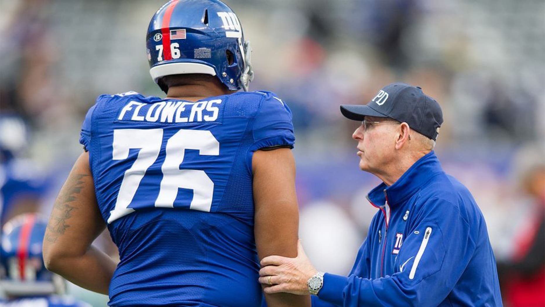 Oct 25, 2015; East Rutherford, NJ, USA; New York Giants head coach Tom Coughlin takes to offensive tackle Ereck Flowers (76) before the game against the Dallas Cowboys at MetLife Stadium. Mandatory Credit: William Hauser-USA TODAY Sports