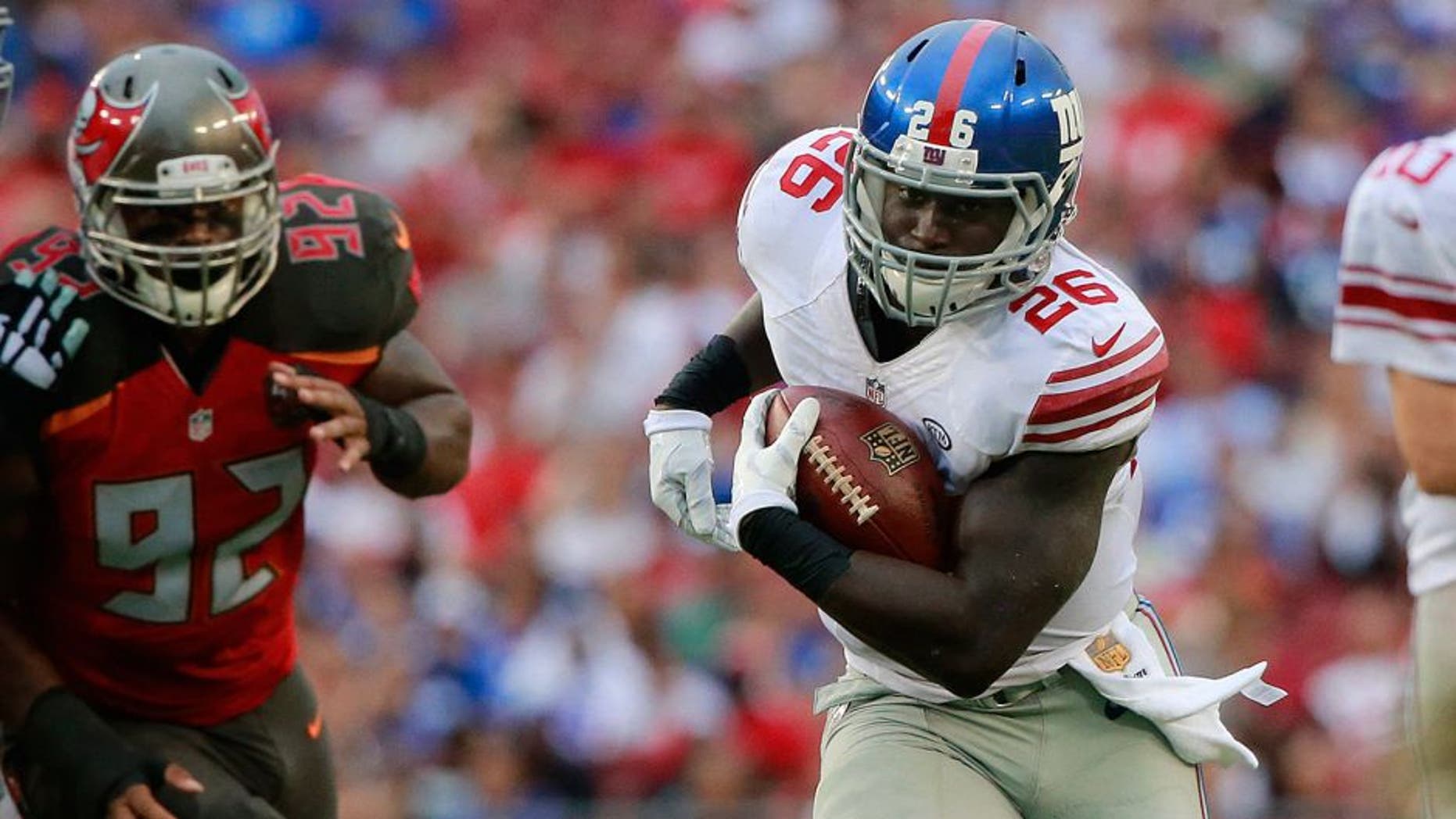 Nov 8, 2015; Tampa, FL, USA; New York Giants running back Orleans Darkwa (26) runs with the ball against the Tampa Bay Buccaneers during the first half at Raymond James Stadium. Mandatory Credit: Kim Klement-USA TODAY Sports