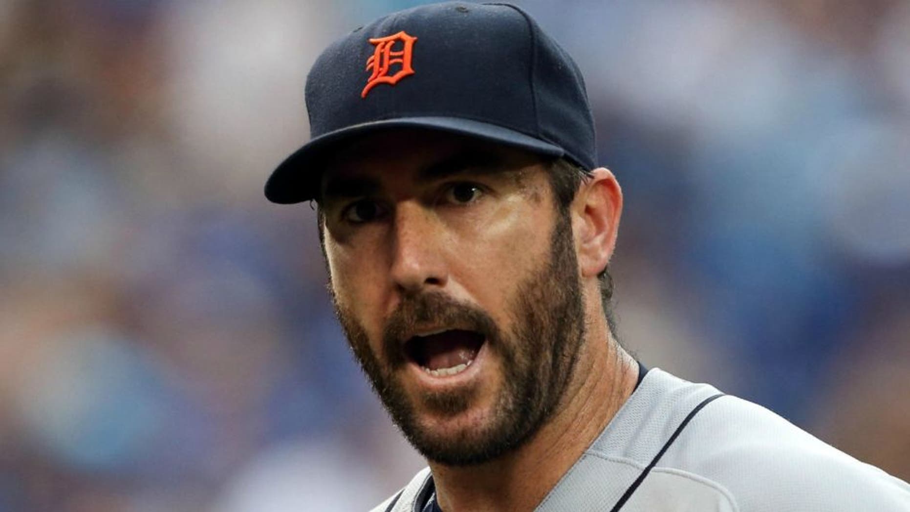 Jul 7, 2016; Toronto, Ontario, CAN; Detroit Tigers starting pitcher Justin Verlander (35) exchanges word with a teammate in the second inning during MLB game action against the Toronto Blue Jays at Rogers Centre. Blue Jays won 5-4.Mandatory Credit: Kevin Sousa-USA TODAY Sports