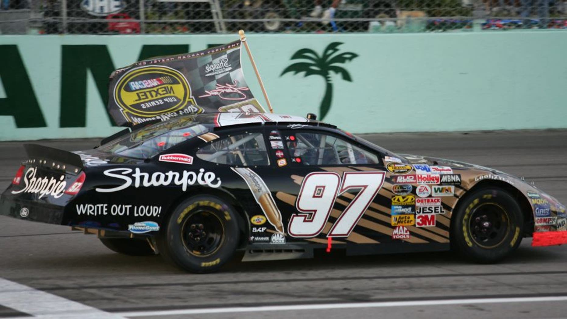 HOMESTEAD, FL - NOVEMBER 21: Kurt Busch, driver of the #97 Roush Racing Sharpie Ford, celebrates after winning the NASCAR Nextel Cup Series Championship at the Ford 400 on November 21, 2004 at the Homestead Miami Speedway in Homestead, Florida. (Photo by Robert Laberge/Getty Images)