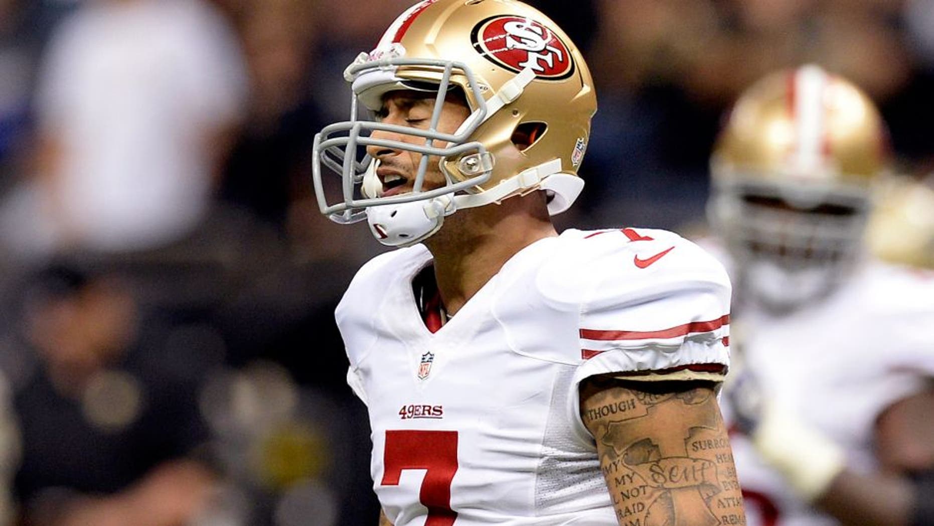 Nov 17, 2013; New Orleans, LA, USA; San Francisco 49ers quarterback Colin Kaepernick (7) reacts following a failed third down conversion against the New Orleans Saints during the fourth quarter at the Mercedes-Benz Superdome. The New Orleans Saints defeated the San Francisco 49ers 23-20. Mandatory Credit: John David Mercer-USA TODAY Sports