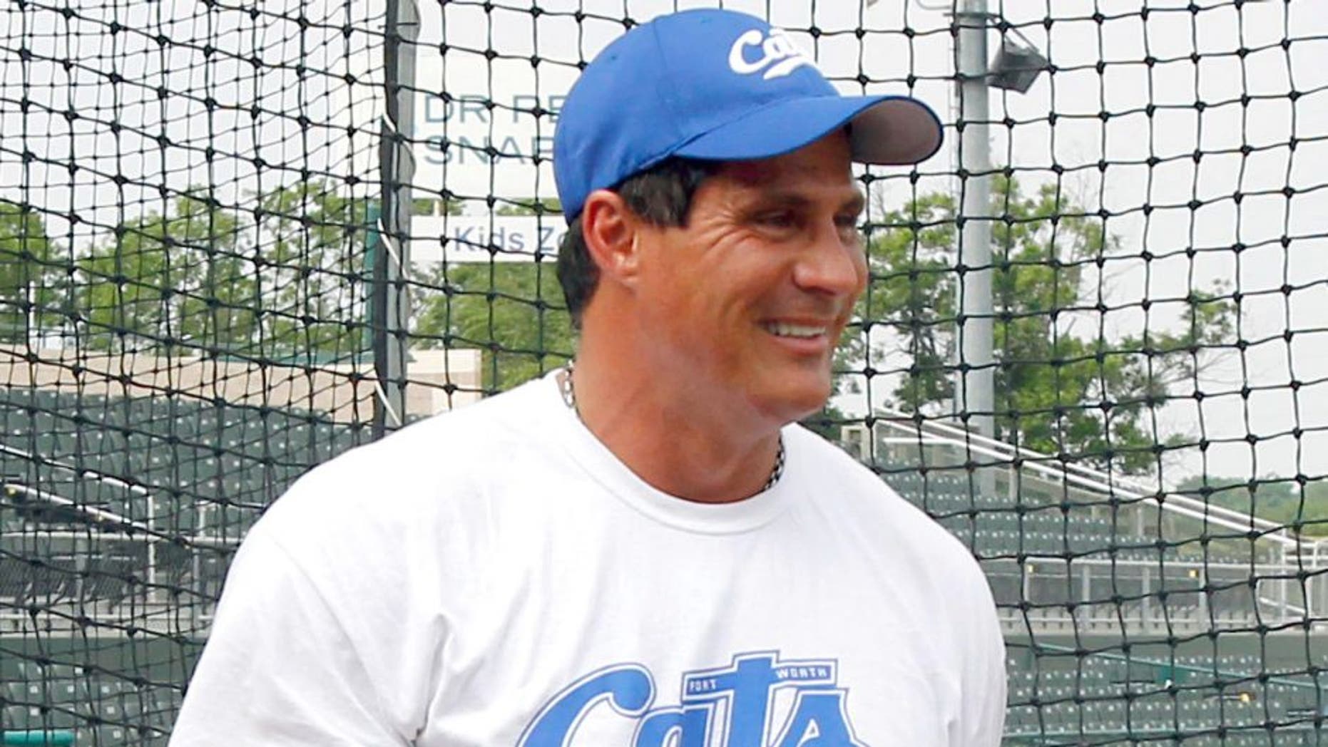 May 23, 2013; Fort Worth, TX, USA; Fort Worth Cats designated hitter Jose Canseco (33) smiles while on the field during batting practice before the game against the Edinburg Roadrunners at LaGrave Field in Fort Worth. Mandatory Credit: Tim Heitman-USA TODAY Sports