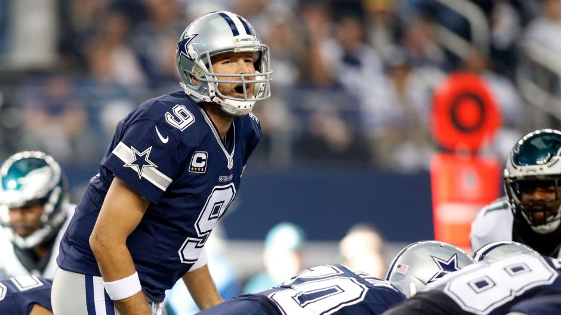 Nov 27, 2014; Arlington, TX, USA; Dallas Cowboys quarterback Tony Romo (9) calls a play at the line of scrimmage in the first quarter against the Philadelphia Eagles at AT&T Stadium. Mandatory Credit: Tim Heitman-USA TODAY Sports