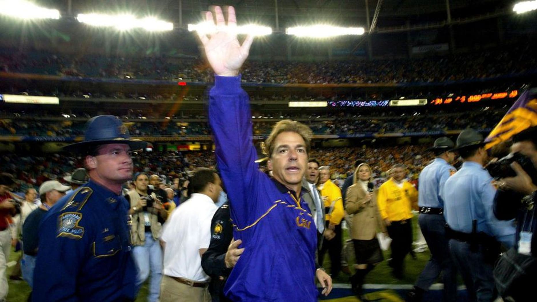ATLANTA - DECEMBER 6: Head coach Nick Saban of the LSU Tigers waves to the fans after LSU defeated the Georgia Bulldogs 34-13 to win the SEC Championship Game on December 6, 2003 at the Georgia Dome in Atlanta, Georgia. (Photo by Jamie Squire/Getty Images)