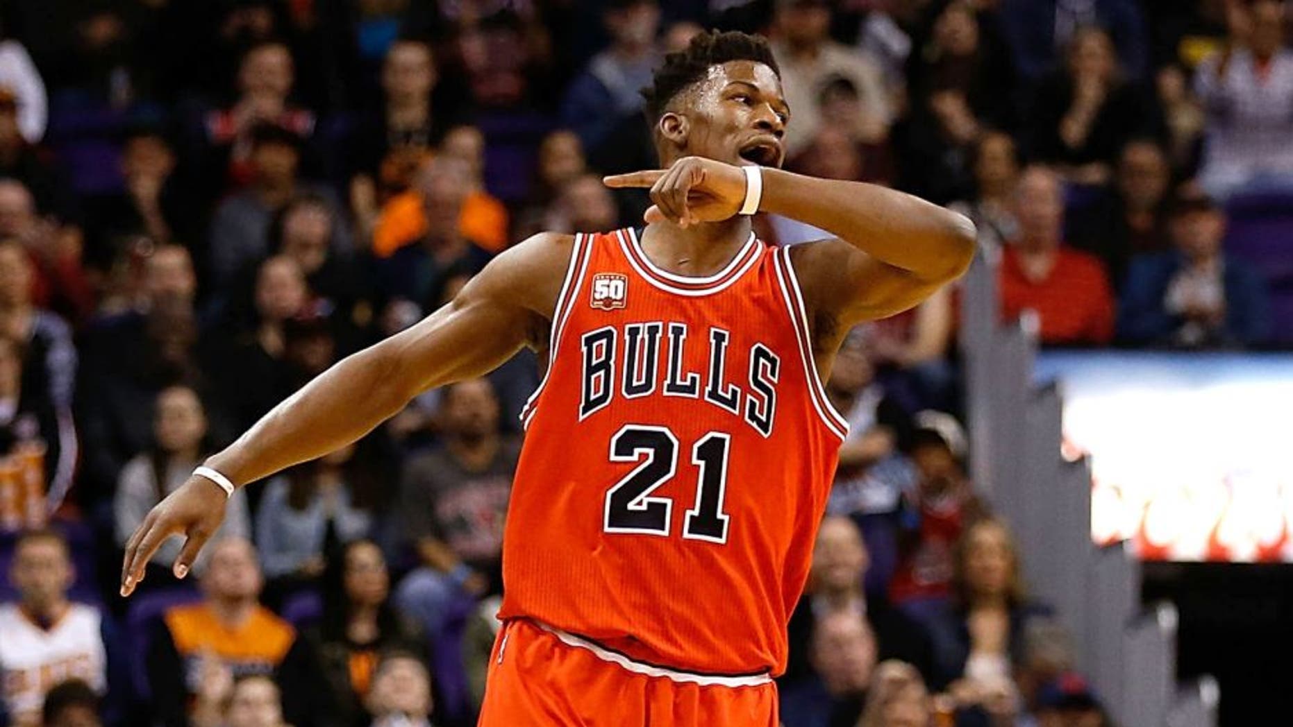 PHOENIX, AZ - NOVEMBER 18: Jimmy Butler #21 of the Chicago Bulls reacts after hitting a three point shot against the Phoenix Suns during the first half of the NBA game at Talking Stick Resort Arena on November 18, 2015 in Phoenix, Arizona. NOTE TO USER: User expressly acknowledges and agrees that, by downloading and or using this photograph, User is consenting to the terms and conditions of the Getty Images License Agreement. (Photo by Christian Petersen/Getty Images)