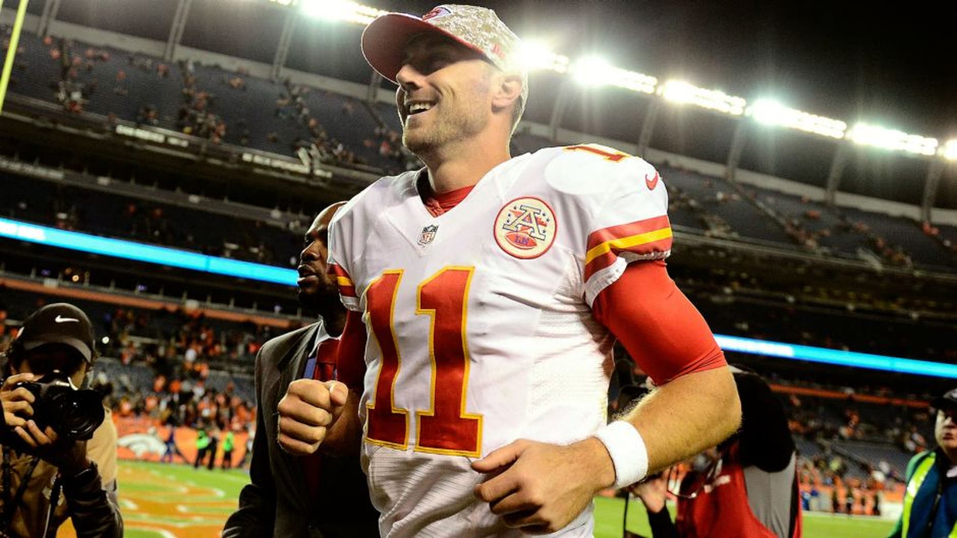 Nov 15, 2015; Denver, CO, USA; Kansas City Chiefs quarterback Alex Smith (11) celebrates the win over the Denver Broncos at Sports Authority Field at Mile High. The Chiefs defeated the Broncos 29-13. Mandatory Credit: Ron Chenoy-USA TODAY Sports