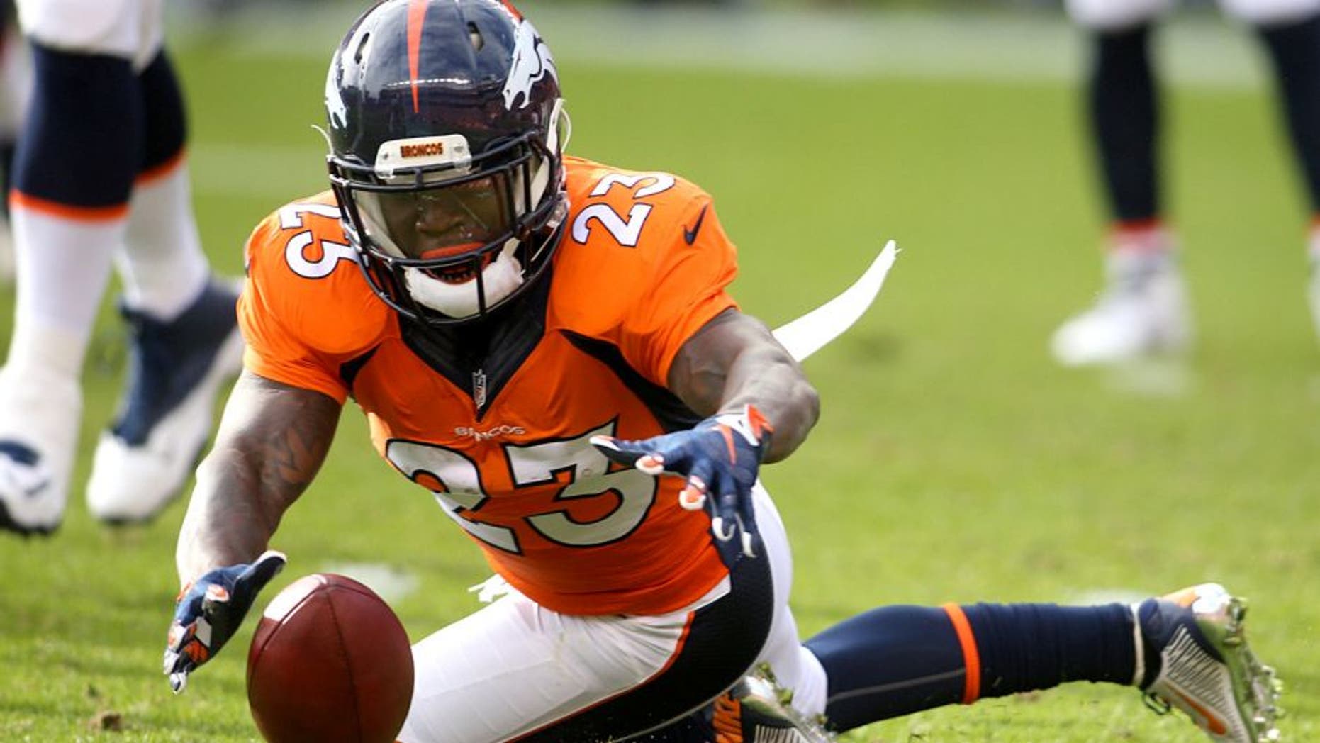 Nov 15, 2015; Denver, CO, USA; Denver Broncos running back Ronnie Hillman (23) dives to recover a fumble by quarterback Peyton Manning (not pictured) during the first half against the Kansas City Chiefs at Sports Authority Field at Mile High. Mandatory Credit: Chris Humphreys-USA TODAY Sports