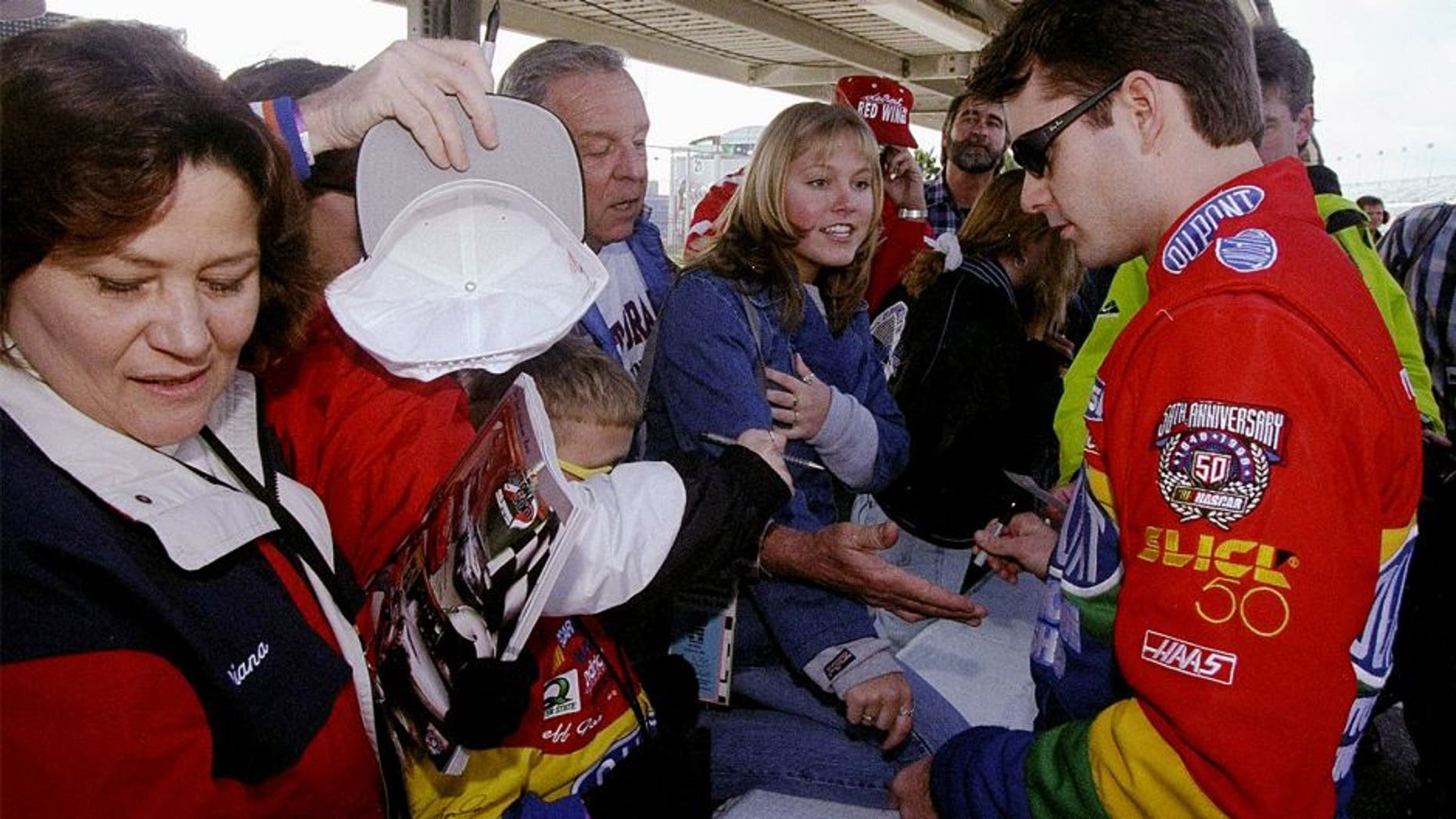 8 Feb 1998: Jeff Gordon signs autographs for fans during the Nascar Daytona 500 at the Daytona International Speedway in Daytona Beach, Florida. Mandatory Credit: David Taylor /Allsport