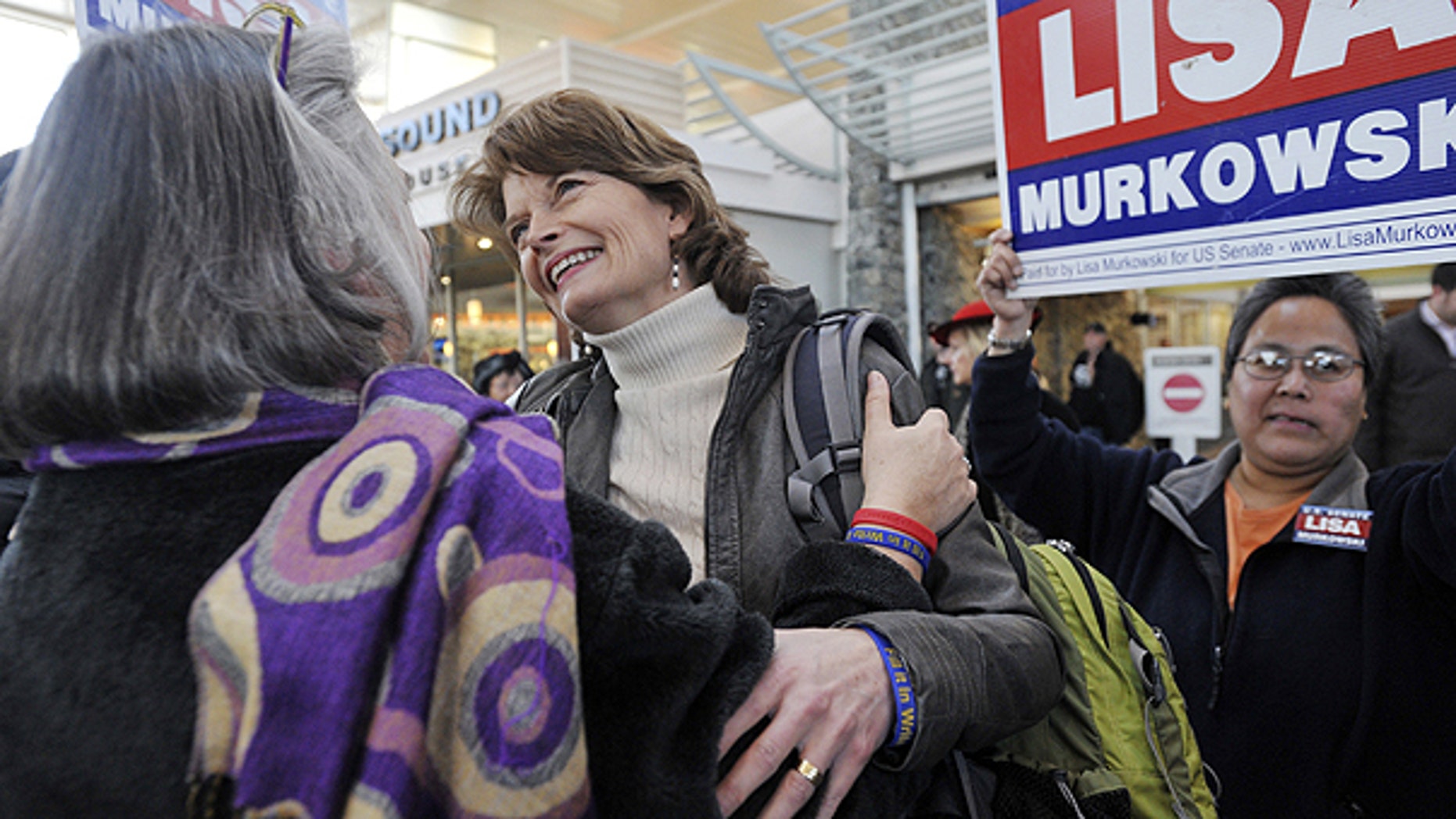 Nov. 17: U.S. Senator Lisa Murkowski (R) Alaska, center, is greeted by her sister Carol Sturgelewski, left, upon her arrival at Ted Stevens International Airport in Anchorage.